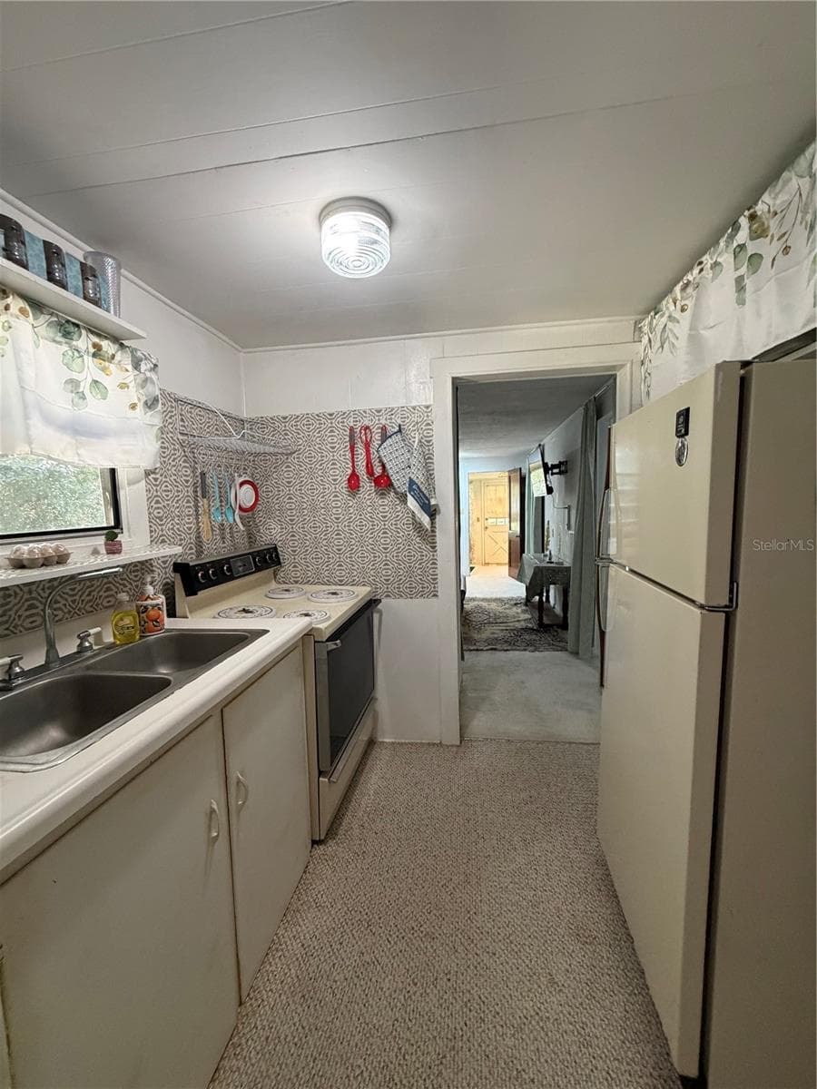 Single Family Residence at 20800 NE 146TH TER, FORT MC COY, photo 6 of 24