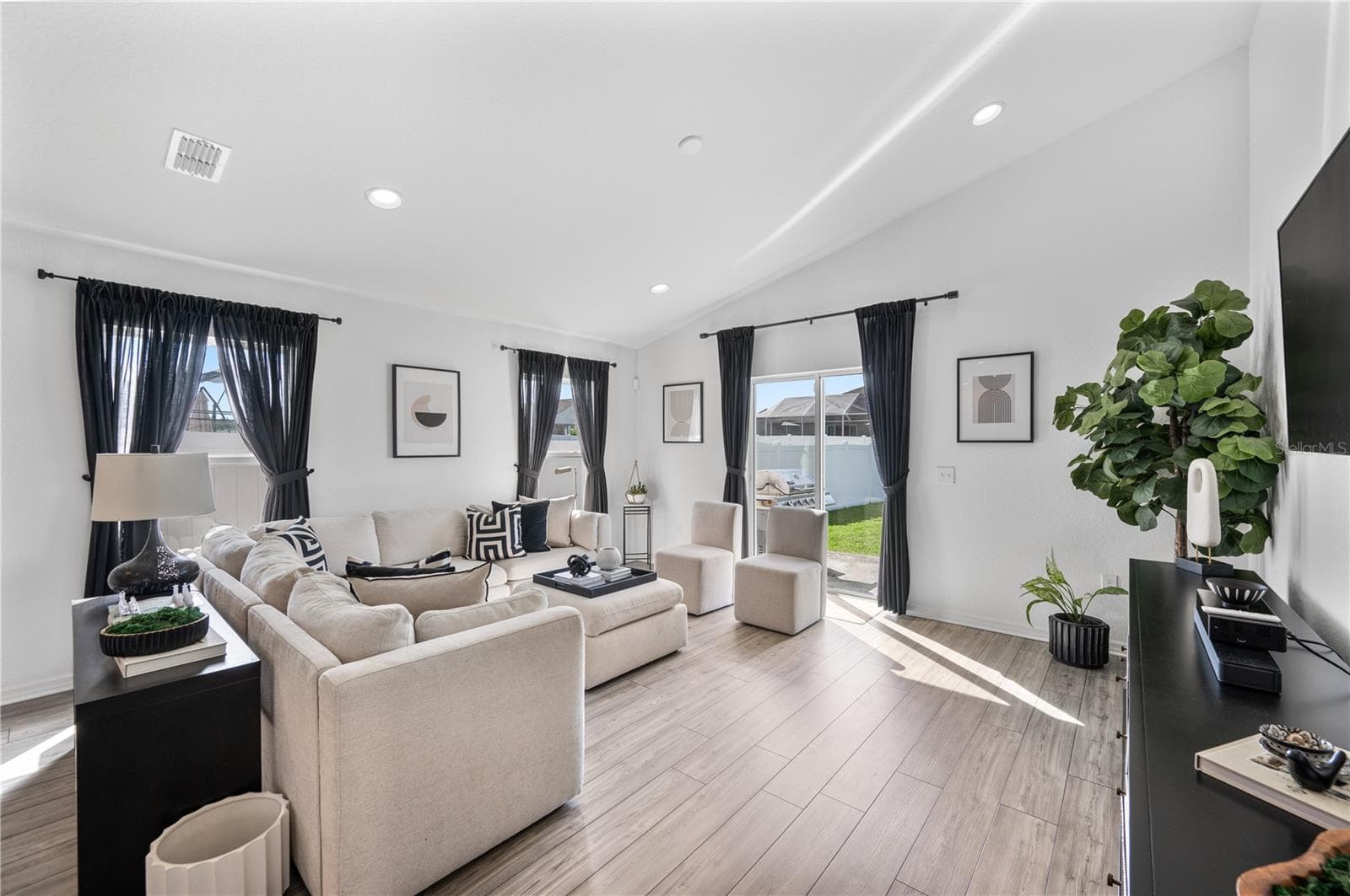 The homes main social space, complete with the entrance to an enormous back yard - 1279 PINTAIL PL, LAKELAND