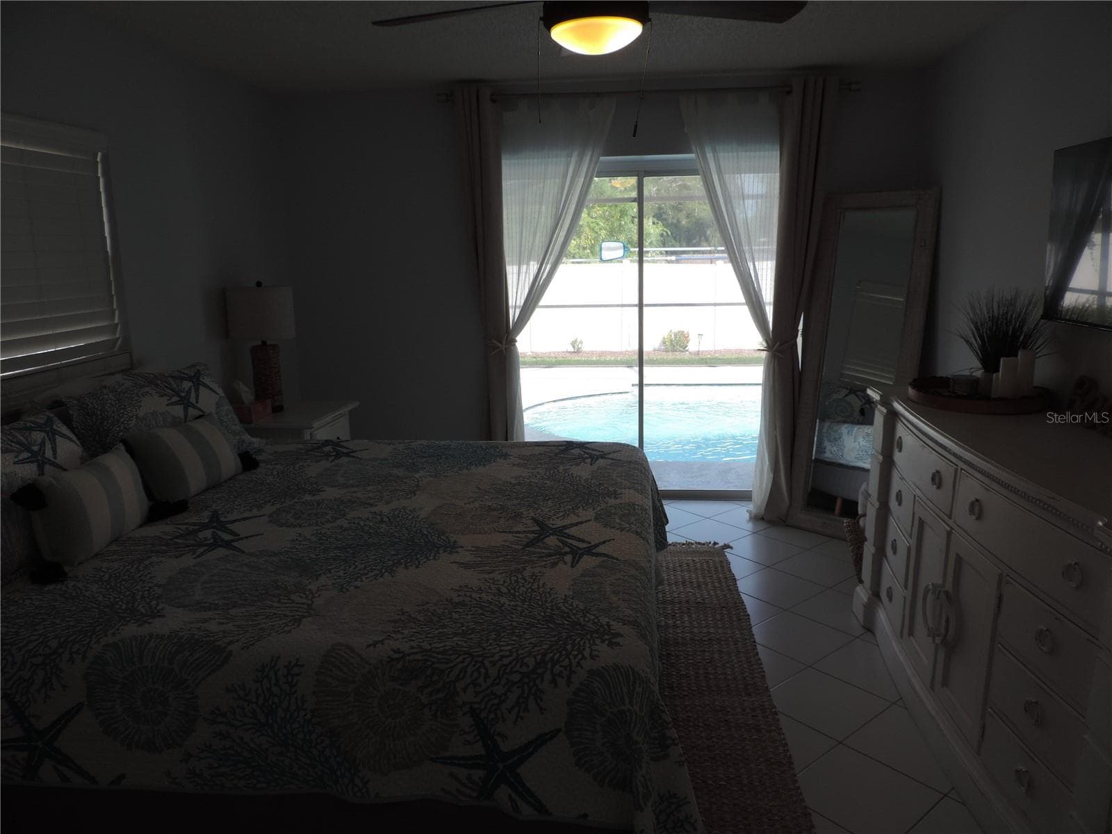 View of pool in primary bedroom with lights off - 1148 ROYAL RD, VENICE