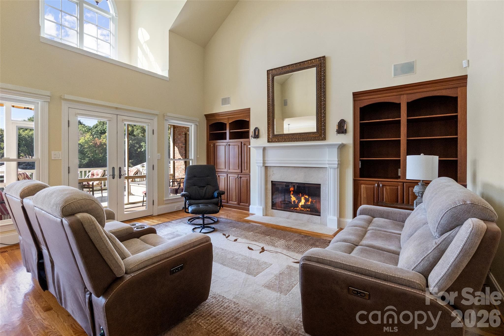 Vaulted family room flooded with light. - 185 E Tattersall Drive, Statesville