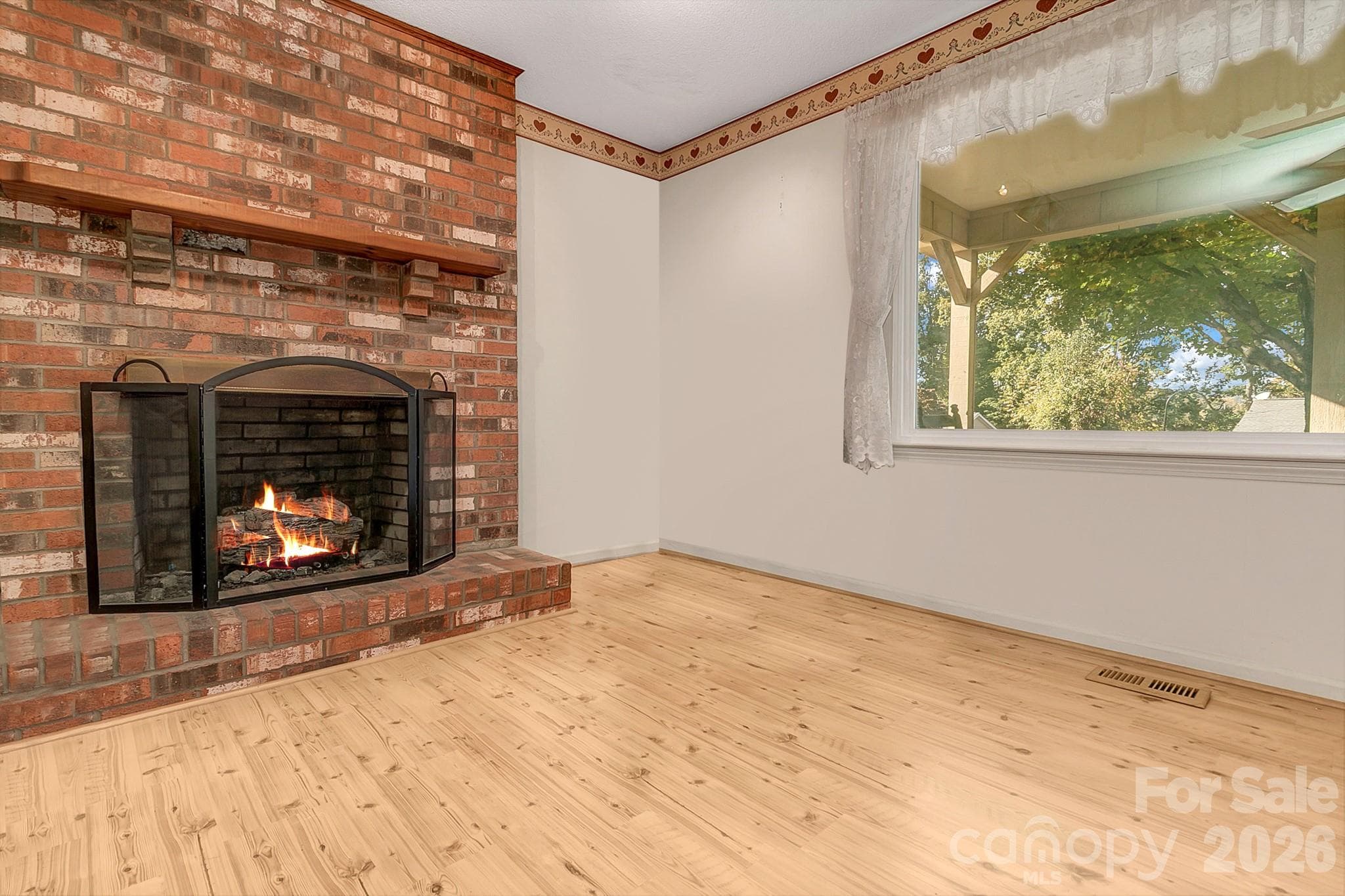 Fireplace w/bay window & natural lighting in room - 1 Dewberry Lane, Hendersonville