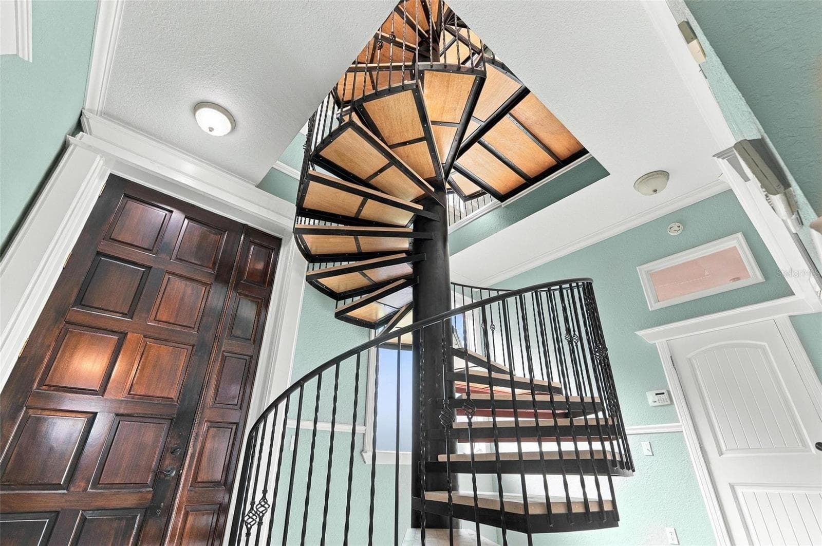 8' Wood front door Foyer with huge sturdy staircase - 2101 N OCEAN SHORE BLVD, FLAGLER BEACH
