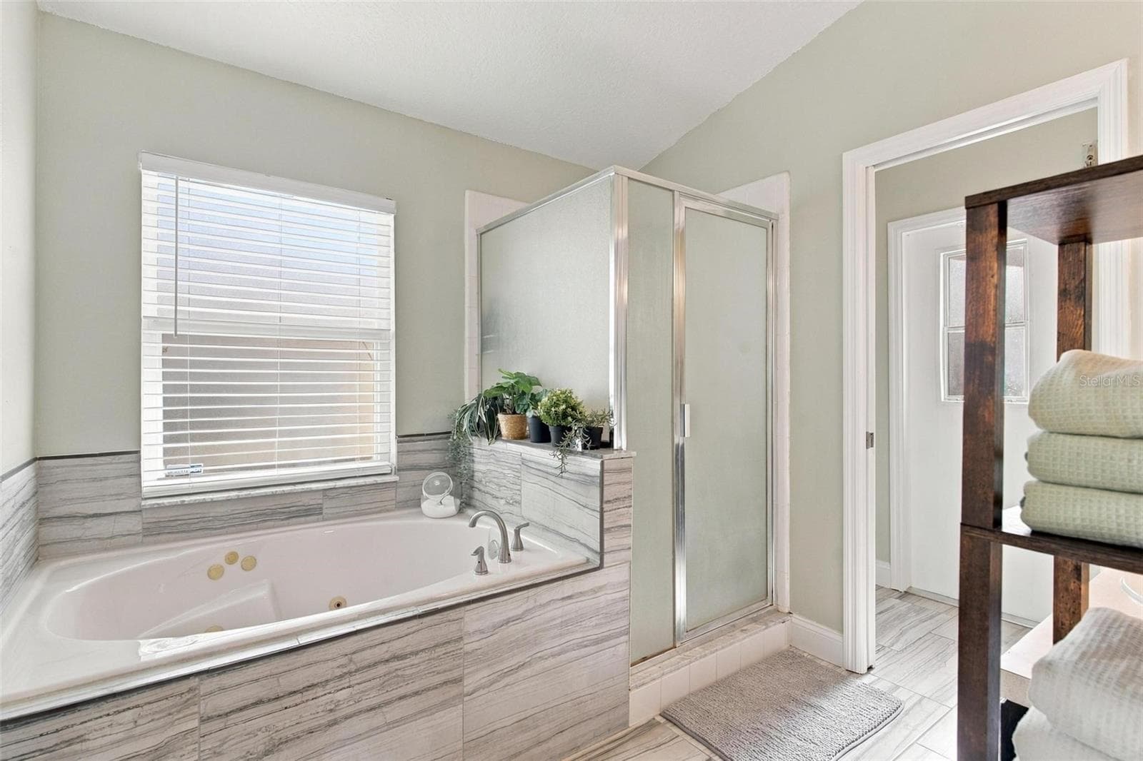 Primary Bathroom with Walk-In Shower and Separate Tub - 945 CLEAR CREEK CIR, CLERMONT