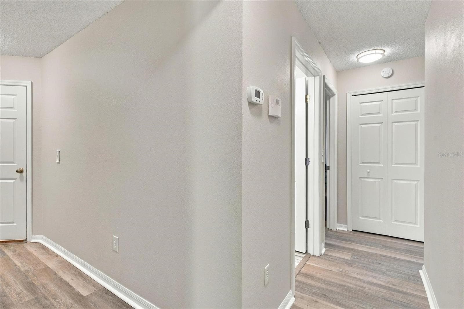 Hallway to Bedrooms - 945 CLEAR CREEK CIR, CLERMONT