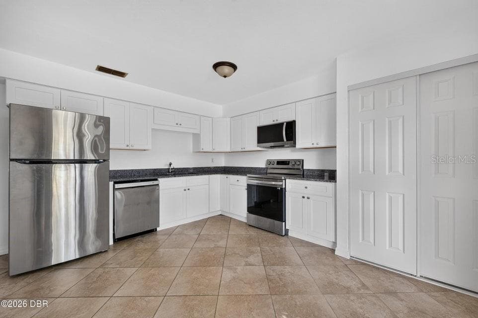 Kitchen with Stainless Appliances - 927 BOULDER DR, SOUTH DAYTONA