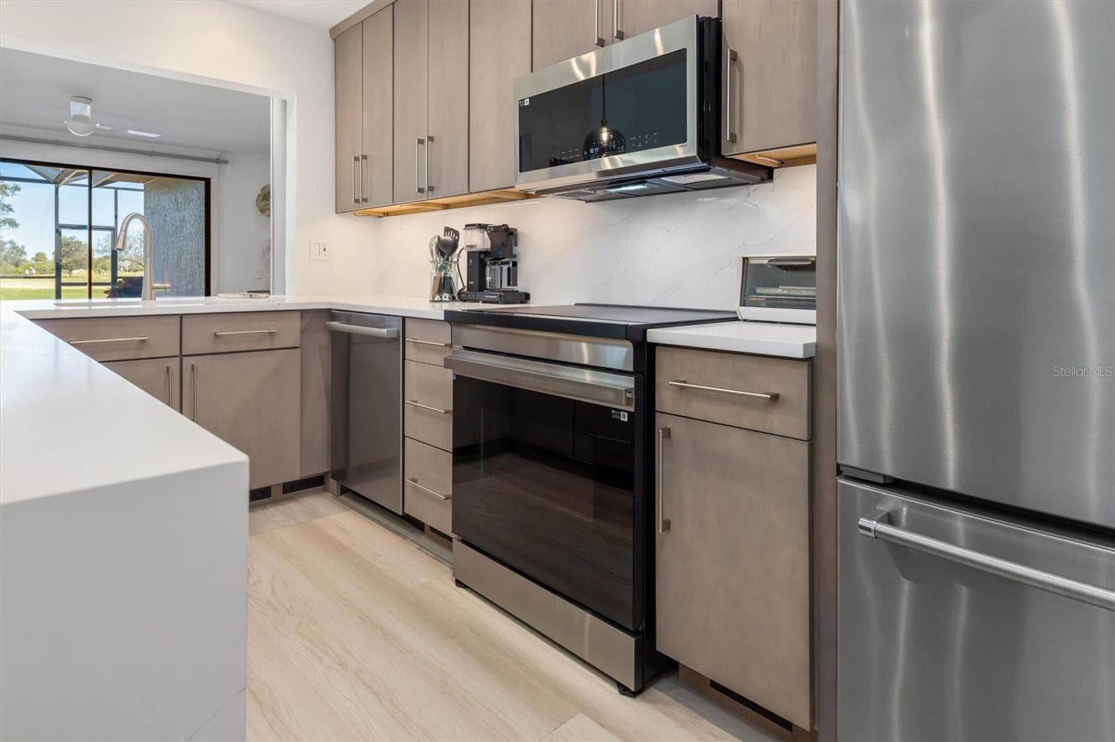 Induction range. Pass through to dining room. - 5021 SAN ROCCO CT, PUNTA GORDA