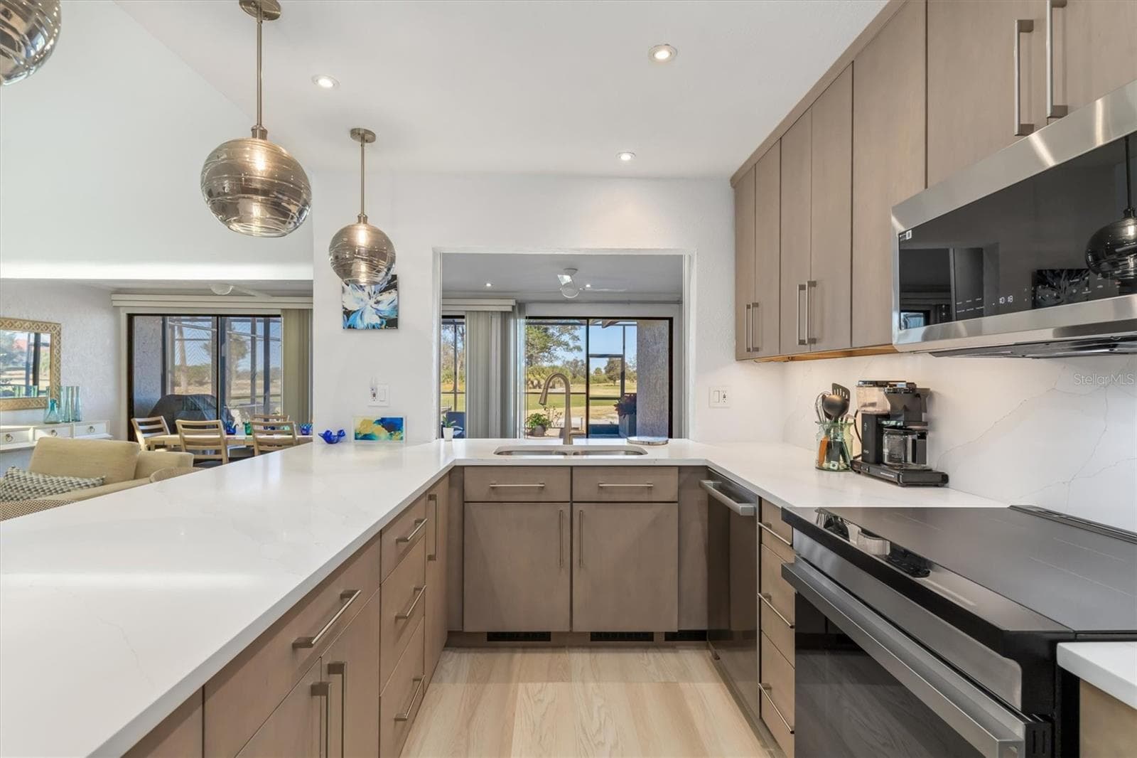 Open to dining/family room with views of golf course. - 5021 SAN ROCCO CT, PUNTA GORDA
