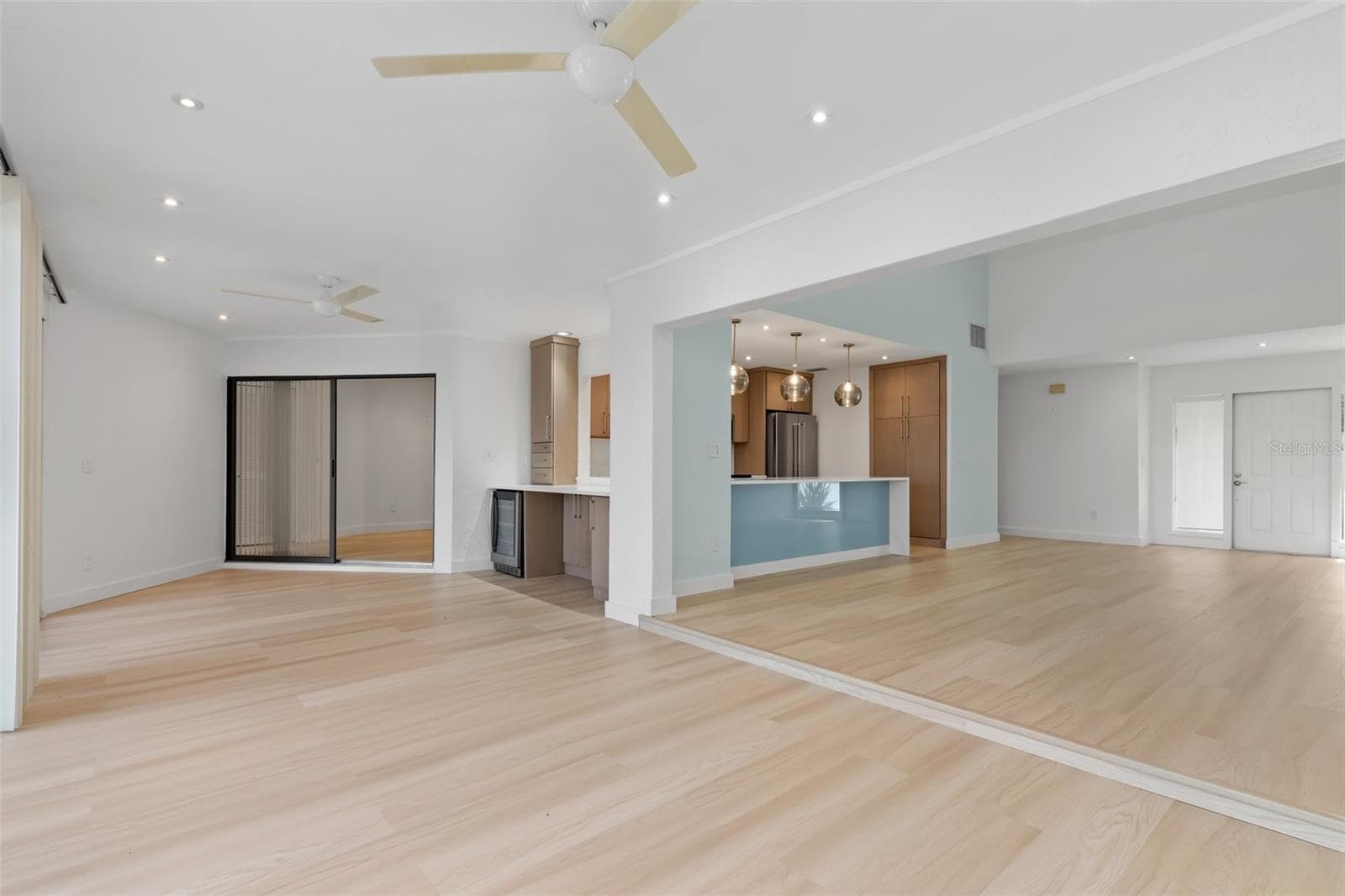 Standing at back sliders of family room and looking at open interior space. Dining, wine cooler, entertainment area. - 5021 SAN ROCCO CT, PUNTA GORDA