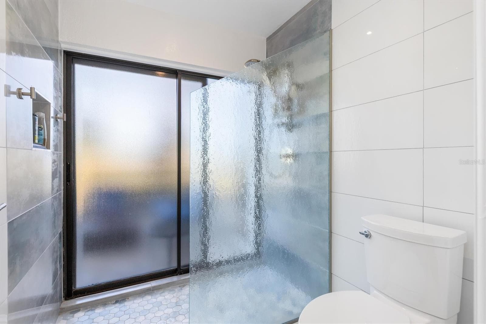 Glass shower and slider to lanai. Handy access for your hot tub. - 5021 SAN ROCCO CT, PUNTA GORDA