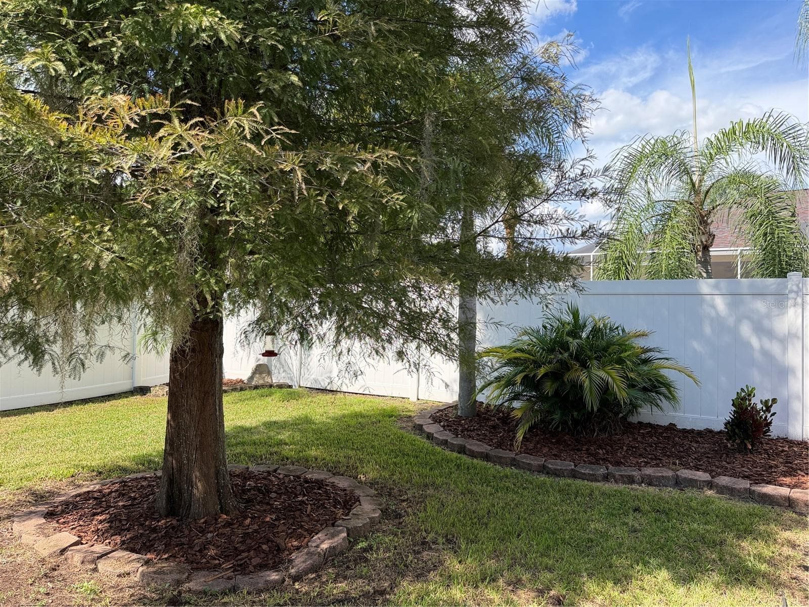 A privacy fence wraps around back yard - 2311 OASIS DR, LAND O LAKES