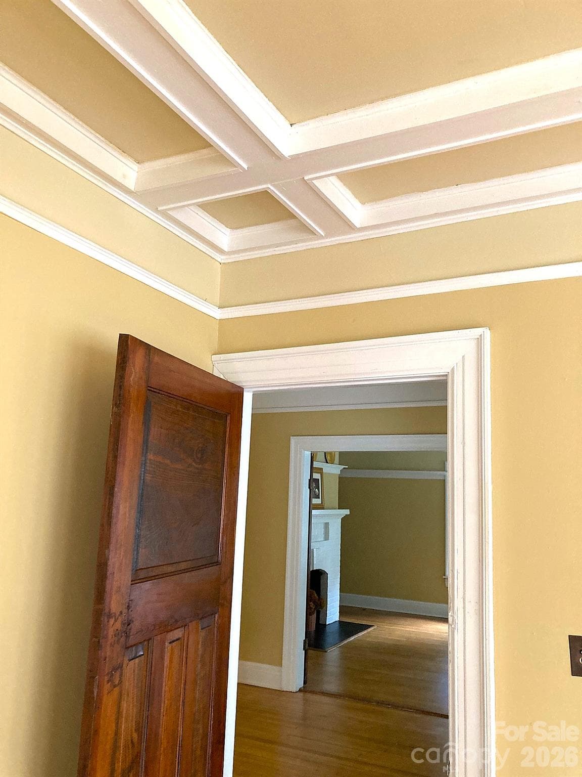 Living Room has coffered ceiling and original paneled doors. - 326 S 3rd Street, Albemarle