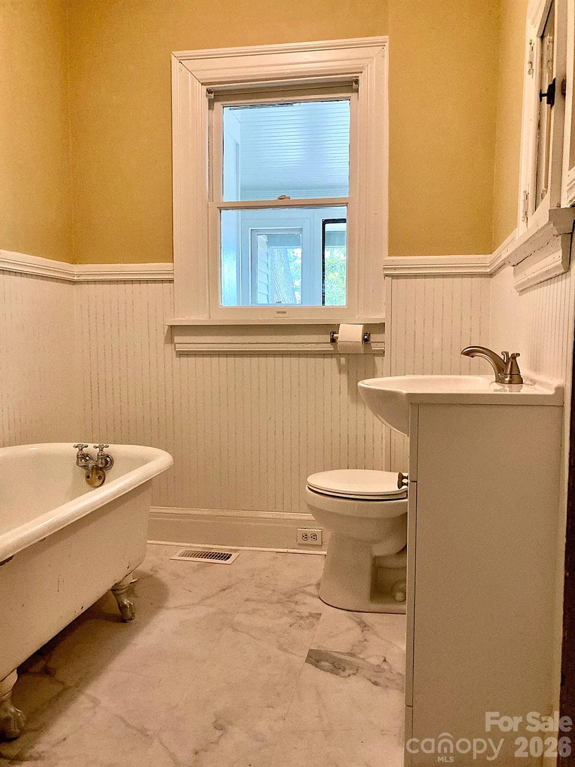 Hall bath with original claw foot tub. - 326 S 3rd Street, Albemarle