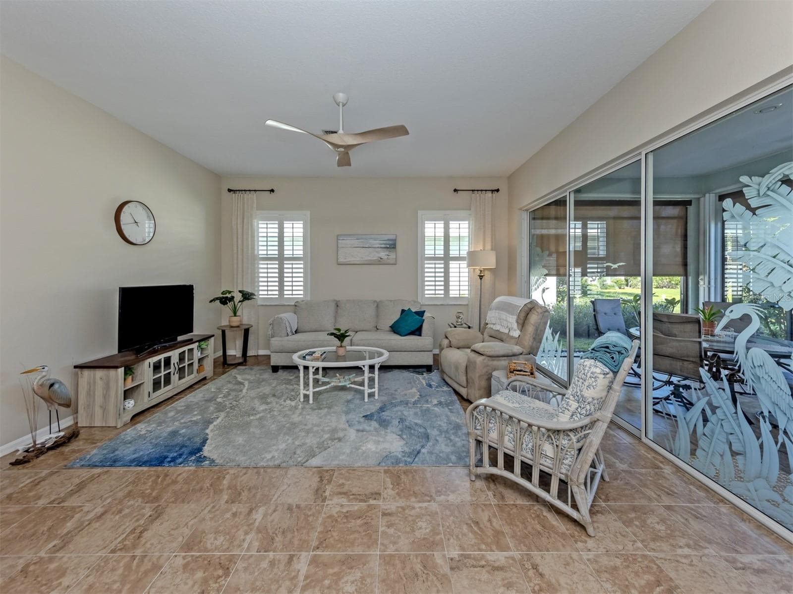 Another lovely perspective of this bright and airy living space, where comfort, elegance, and an effortless flow create the perfect setting for everyday living and entertaining! - 443 BERMUDA ISLES CIR, VENICE