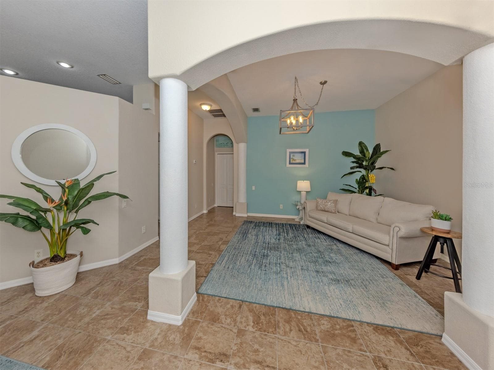 Another inviting view of this charming, versatile space, where soft lighting and a cozy atmosphere create the perfect little retreat to relax, enjoy a good book, or gather for conversation! - 443 BERMUDA ISLES CIR, VENICE