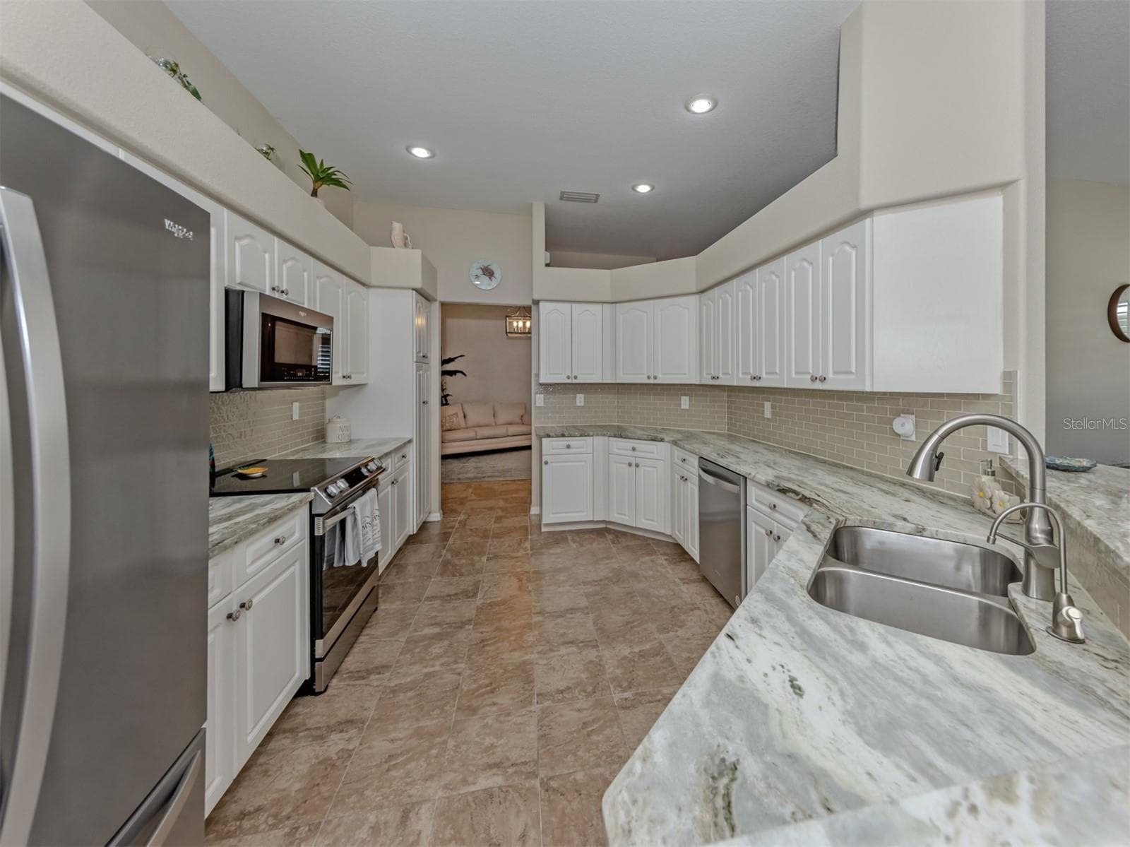 A kitchen that's as welcoming as it is functional, with an easy, open flow and plenty of room to prepare delicious meals, share conversations, and enjoy the simple pleasures of everyday living! - 443 BERMUDA ISLES CIR, VENICE