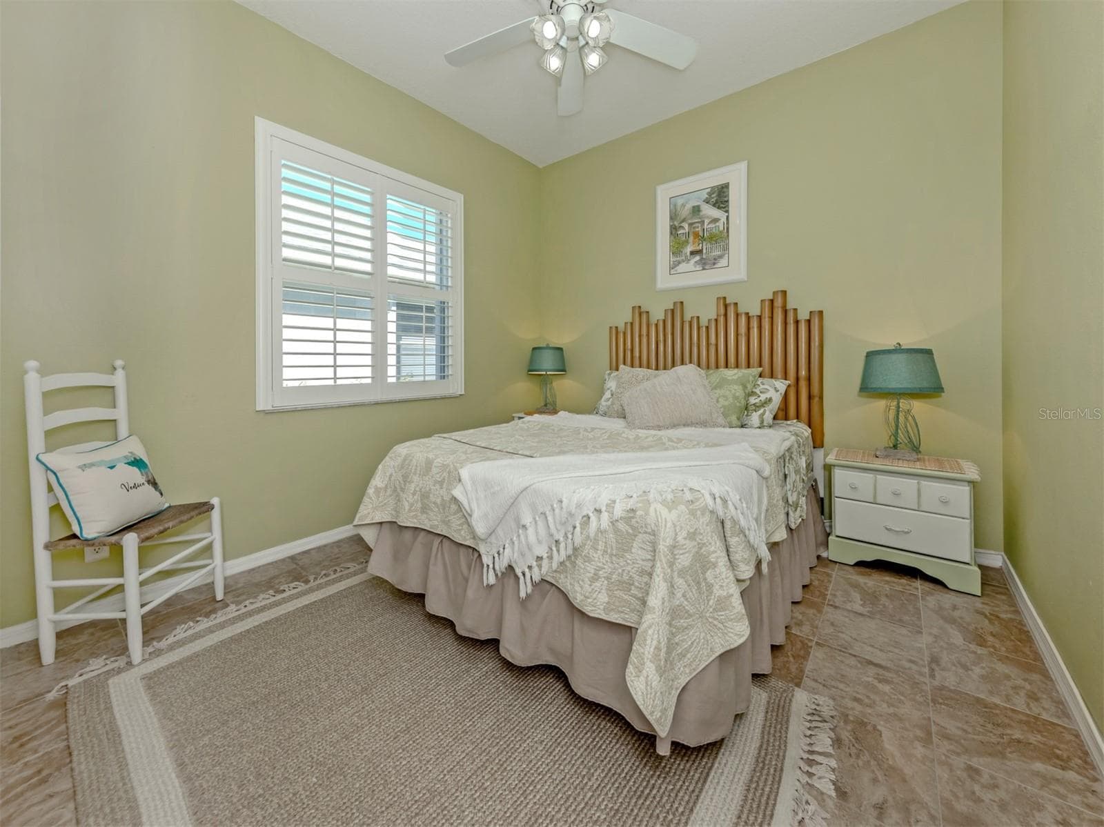 Sweet dreams start here! This lovely guest bedroom is filled with warmth and charm, creating a welcoming haven where family and friends can settle in, feel right at home, and enjoy a little getaway of their own! - 443 BERMUDA ISLES CIR, VENICE