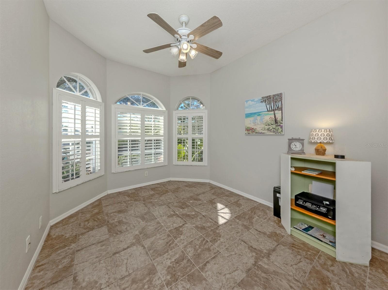Oh, the charm of a beautiful bay window! This delightful bedroom has a personality all its own, with a lovely architectural touch that adds character and creates an inviting space for guests, a stylish home office, or a cozy personal hideaway! - 443 BERMUDA ISLES CIR, VENICE