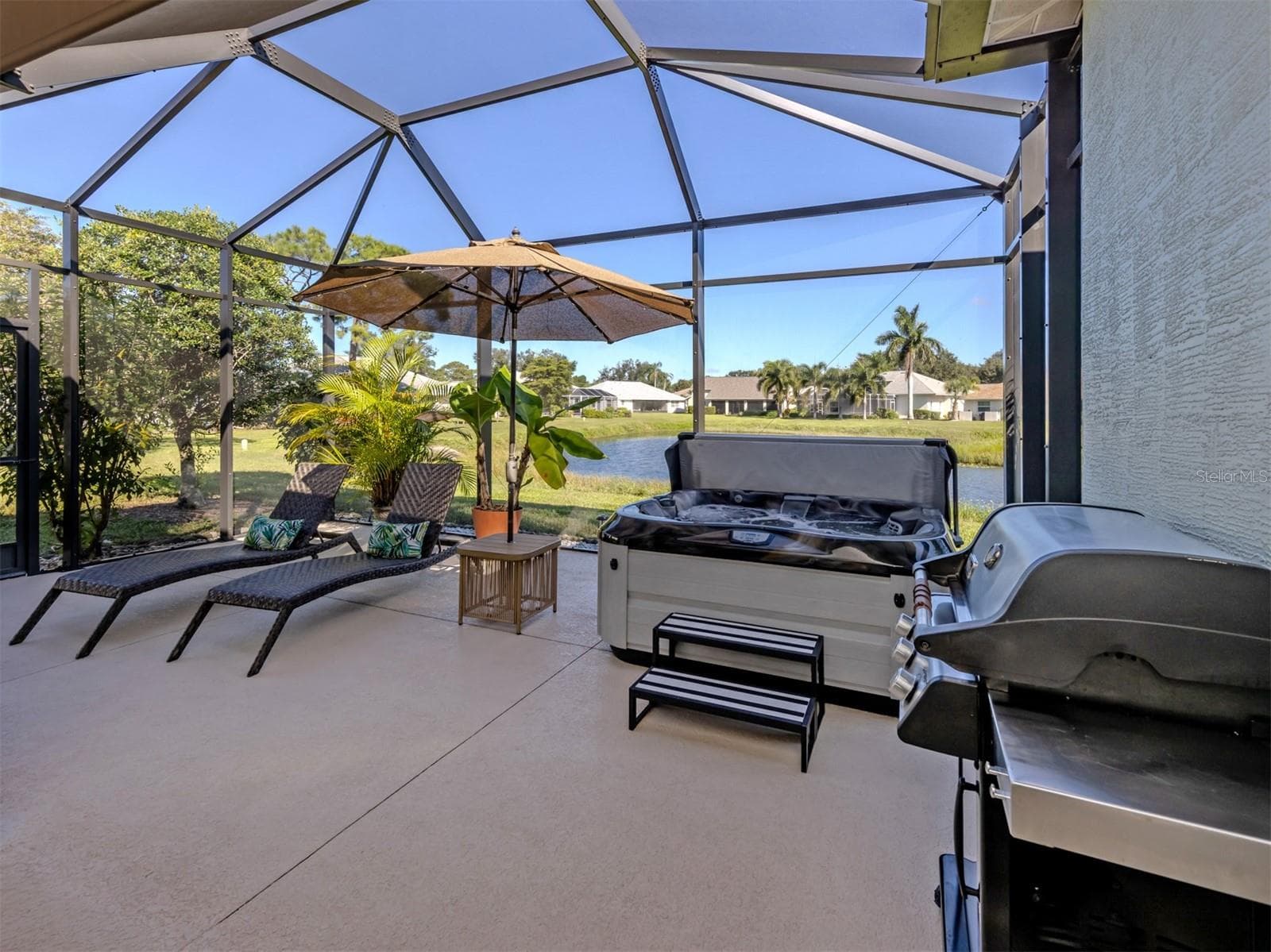 Welcome to your own little slice of Florida paradise! Beautifully expanded in 2023, this fabulous screened lanai is all about sunshine, sparkling lake views, and enjoying the Florida lifestyle! With plenty of space to lounge, entertain, or sip something refreshing while soaking in the peaceful waterfront scenery, this is the kind of outdoor retreat you'll never want to leave! - 443 BERMUDA ISLES CIR, VENICE