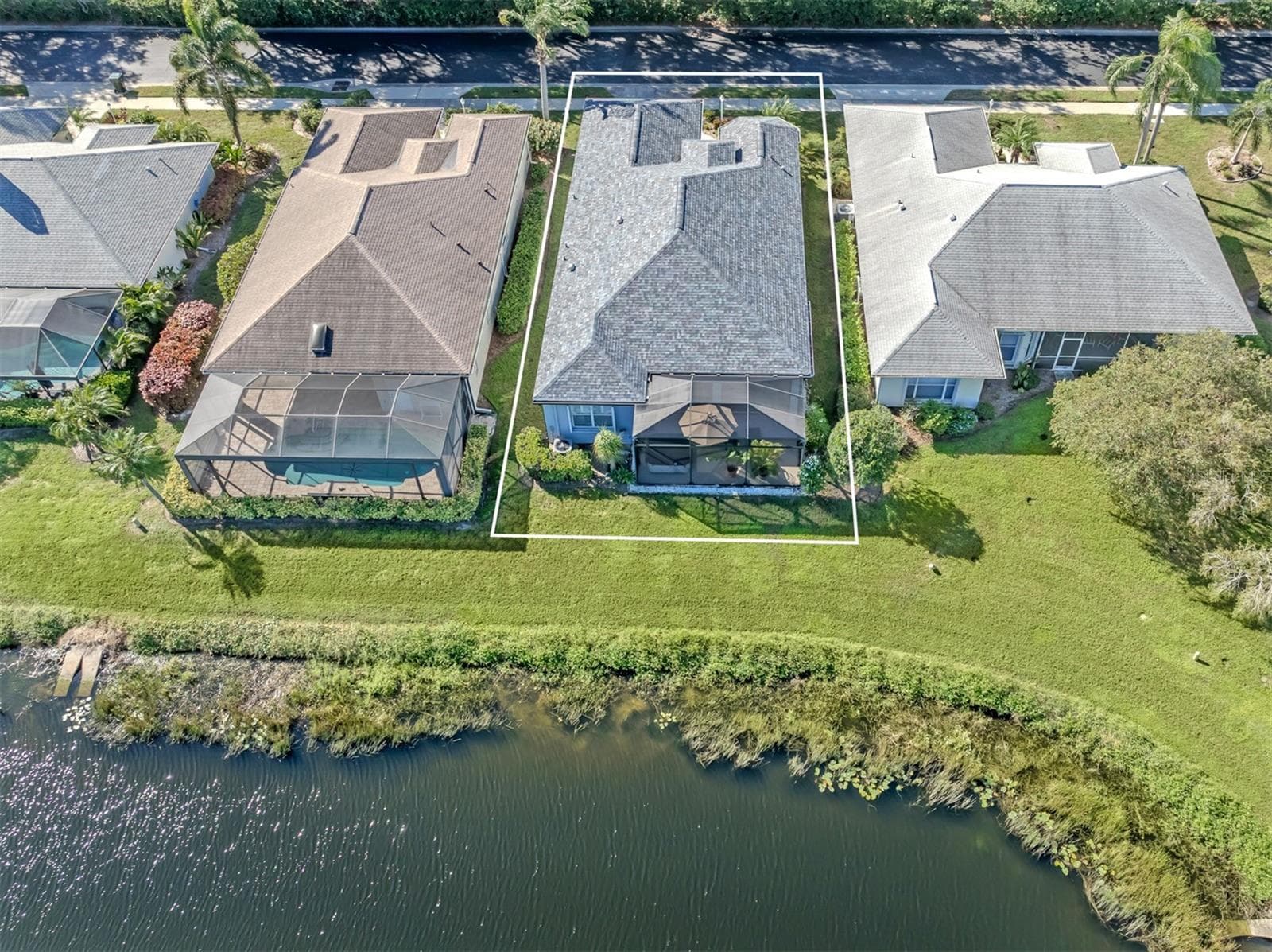 Now that's a view to get excited about! From this incredible vantage point, the sparkling water and lush landscape create a postcard-worthy scene that makes coming home feel like arriving somewhere special! - 443 BERMUDA ISLES CIR, VENICE
