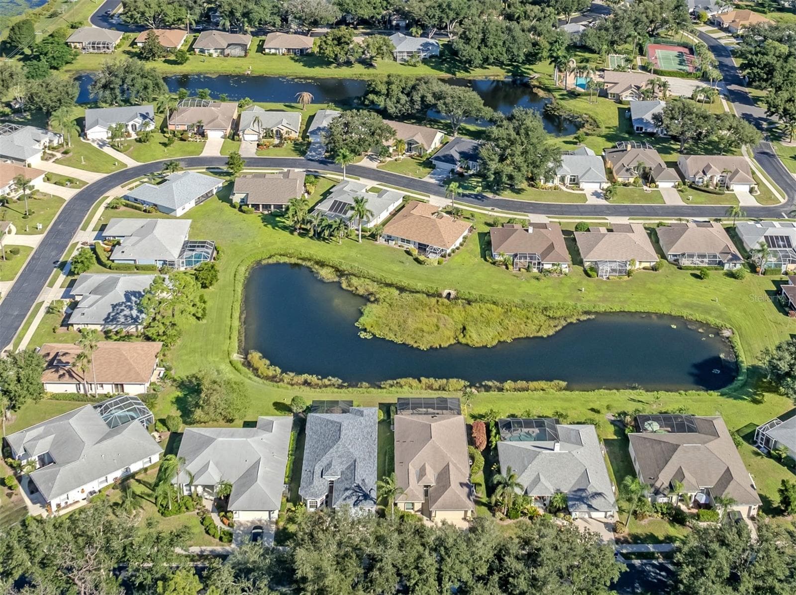 Take a look at the bigger picture! Charming homes, winding streets, and picturesque waterways come together to showcase the wonderful character and peaceful atmosphere of the Isles of Chestnut Creek! - 443 BERMUDA ISLES CIR, VENICE