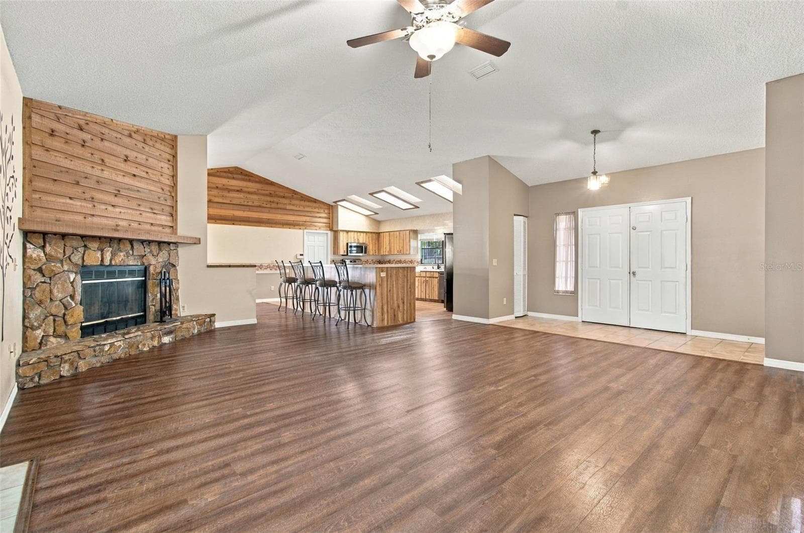 GREAT ROOM WITH STONE FIREPLACE - 3180 LAKE SAXON DR, LAND O LAKES