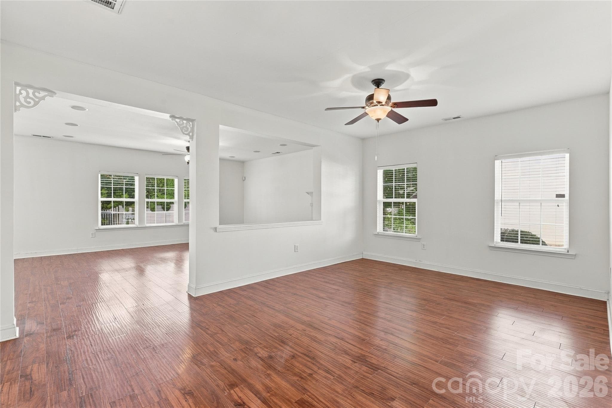 An open, airy layout with lots of natural light and a ceiling fan for year-round comfort. - 327 Annaberg Lane, Monroe