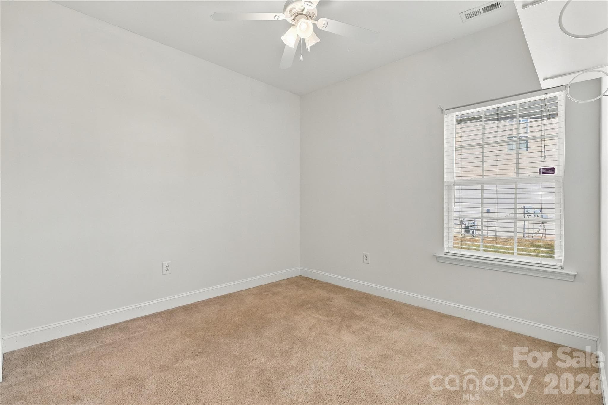 A comfortable bedroom with soft carpet and a window that brings in plenty of light. - 327 Annaberg Lane, Monroe