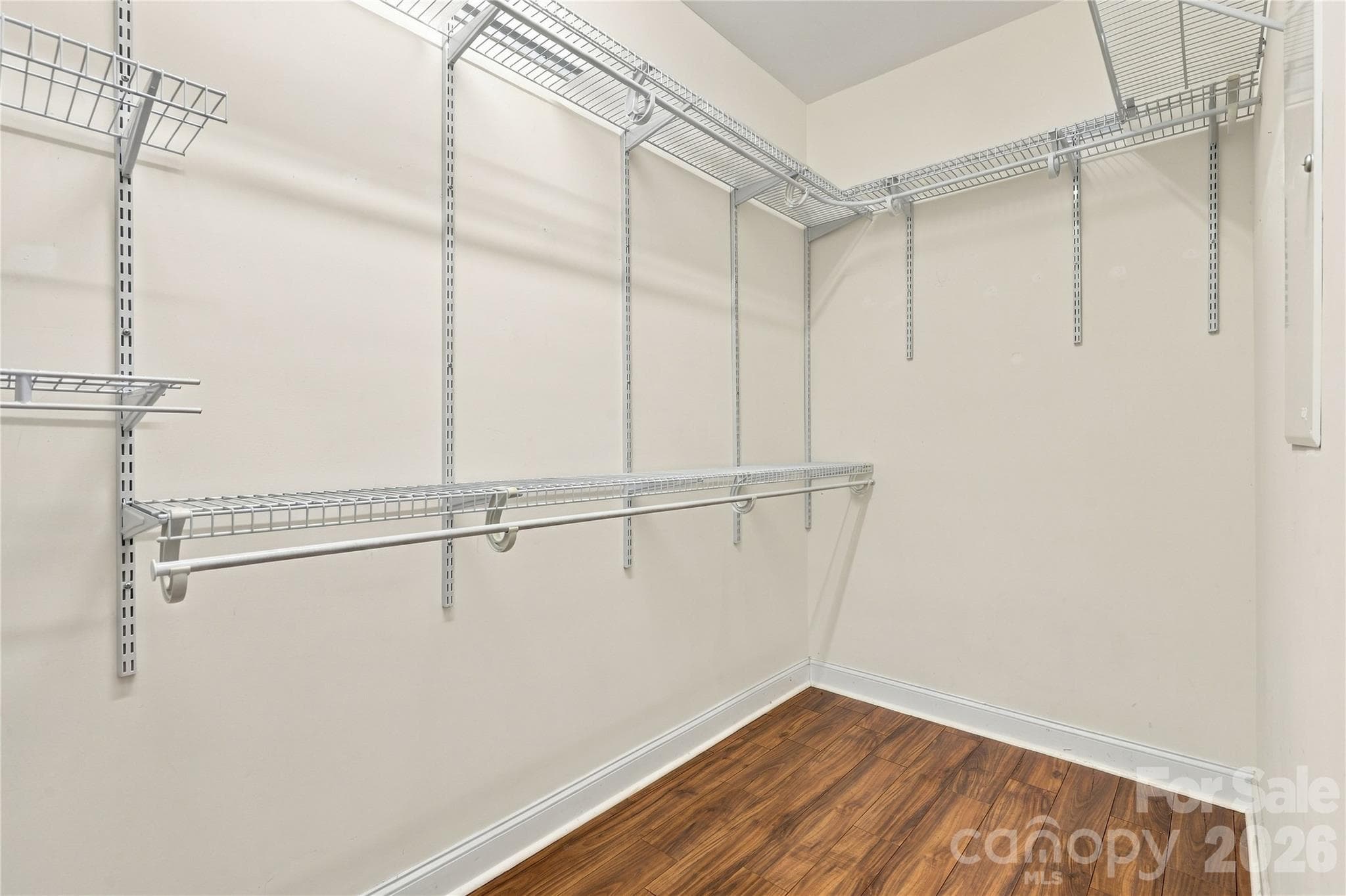 A walk-in closet with built-in shelving gives you room for every season's wardrobe. - 327 Annaberg Lane, Monroe
