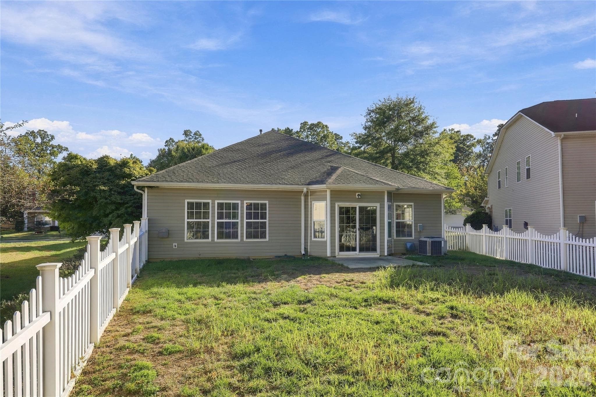 A spacious, fully fenced yard gives you room to play, plant, and make it your own. - 327 Annaberg Lane, Monroe