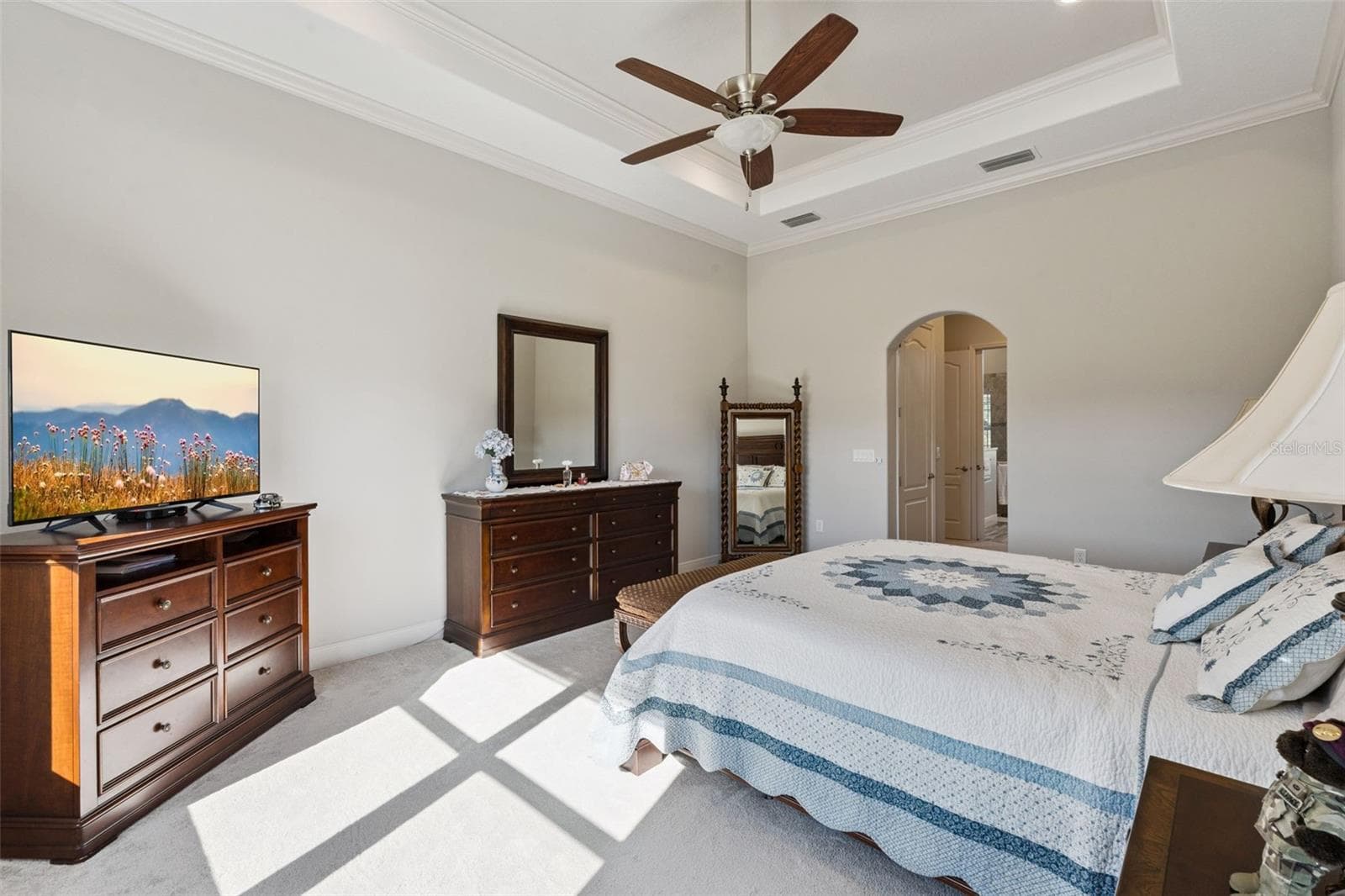 Primary suite featuring a spacious layout and a direct, open view into the private en suite bathroom. - 36819 WOLF CT, EUSTIS