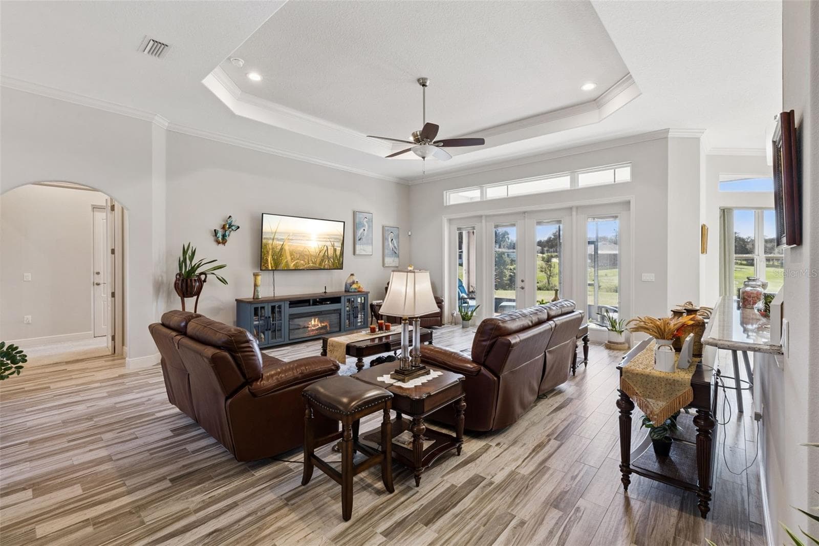 Family room with french doors to screened lanai - 36819 WOLF CT, EUSTIS