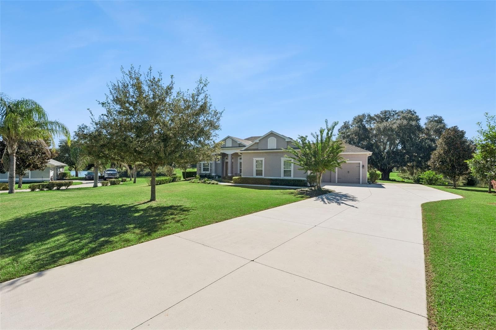 Located on over 1.6 acres with a long private driveway, this property offers unparalleled privacy and a serene atmosphere. The expansive grounds provide ample space for outdoor activities, gardening, or potential future enhancements, while the lengthy driveway creates an inviting sense of seclusion and grandeur as you approach the home. - 36819 WOLF CT, EUSTIS
