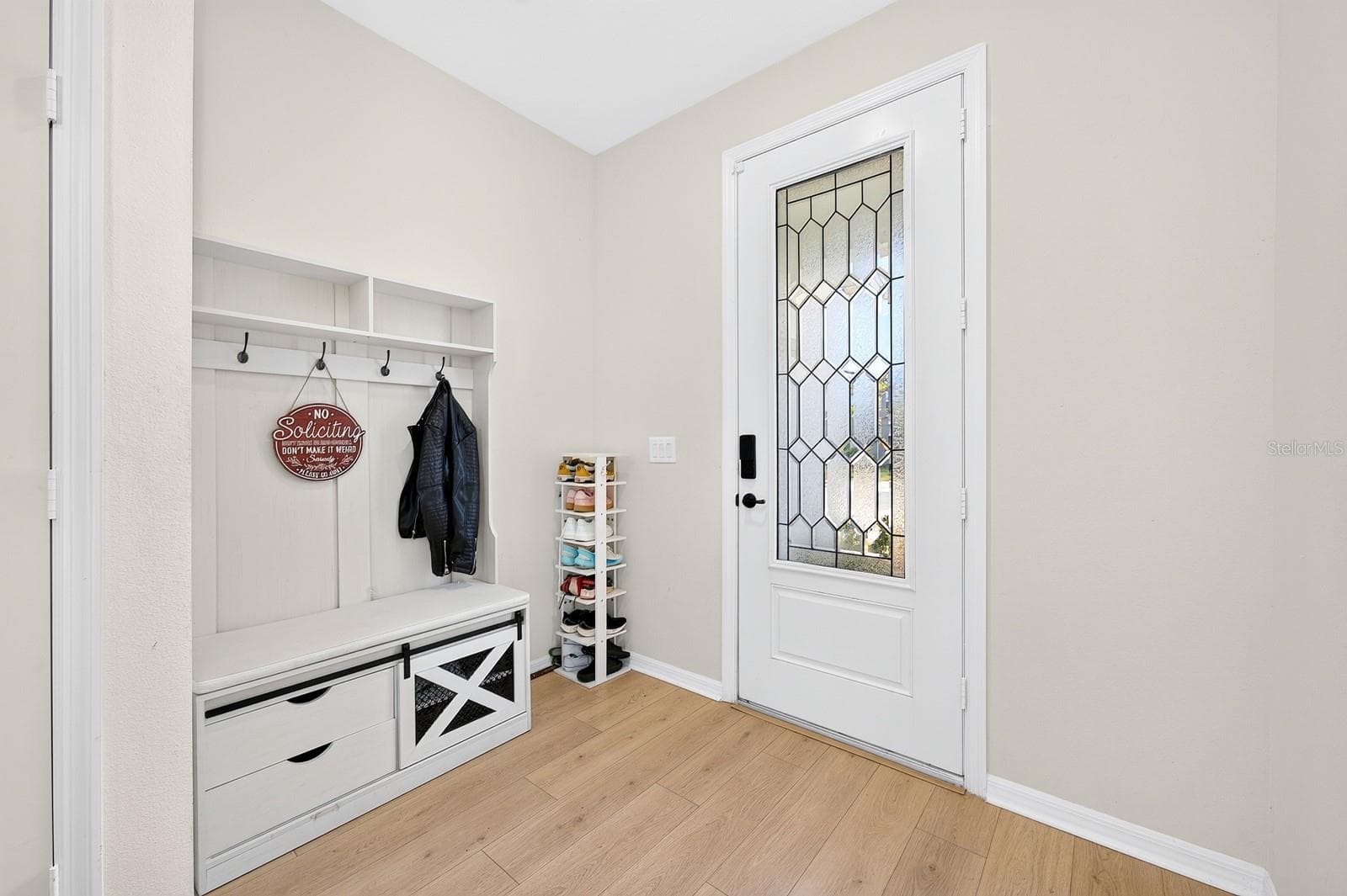Step through the beautiful front door with its DECORATIVE BEVELED, TEXTURED GLASS INSERT. - 1785 PETIOLE PL, KISSIMMEE