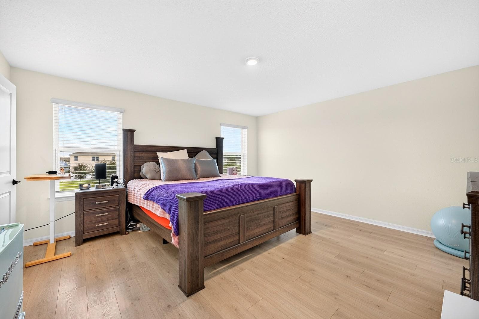 The nearby Primary Suite provides a relaxing retreat, complete with an en suite Bath. - 1785 PETIOLE PL, KISSIMMEE