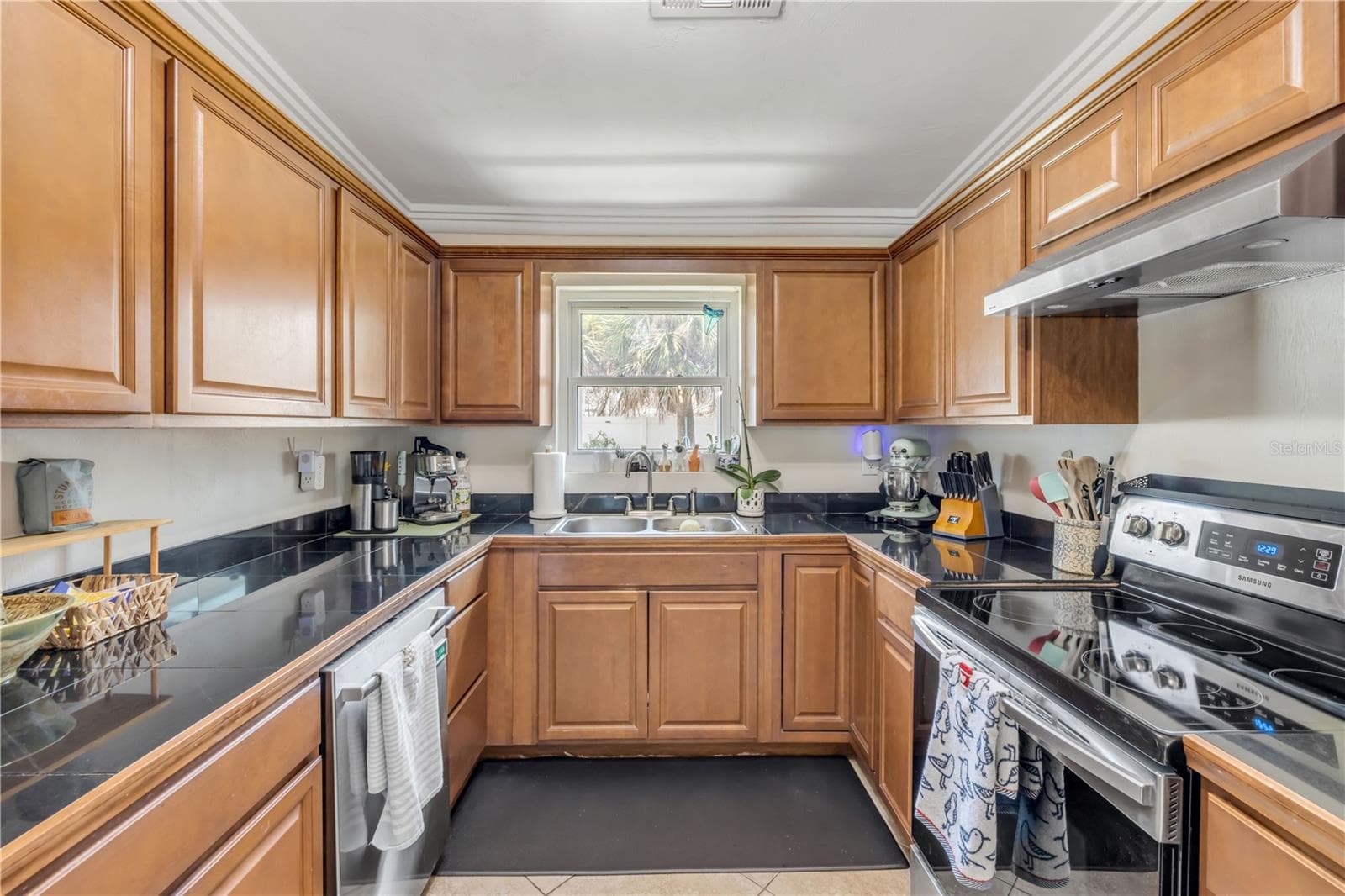Kitchen view highlighting cabinet storage and counter space. - 3929 S PENINSULA DR, PORT ORANGE