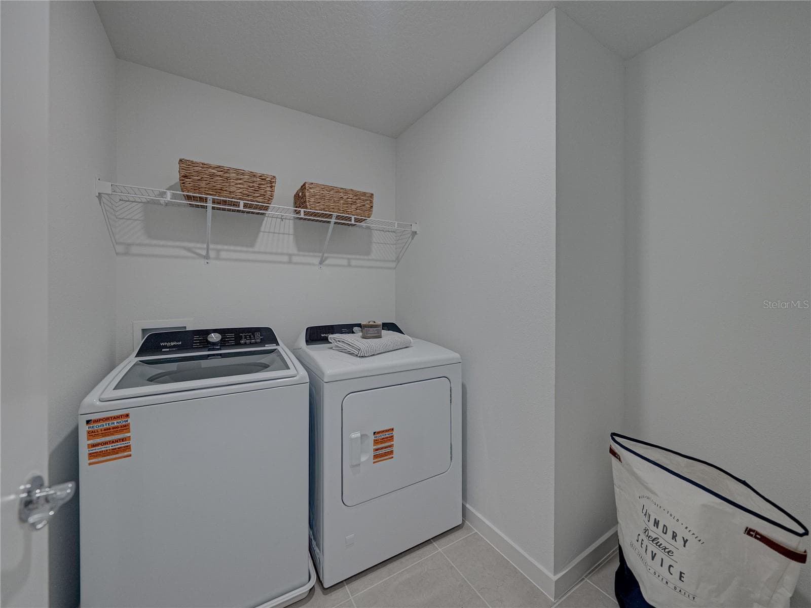 Large Laundry Room with Storage Shelving and Extra Bump out area - 1076 KISTNA DR, ZEPHYRHILLS