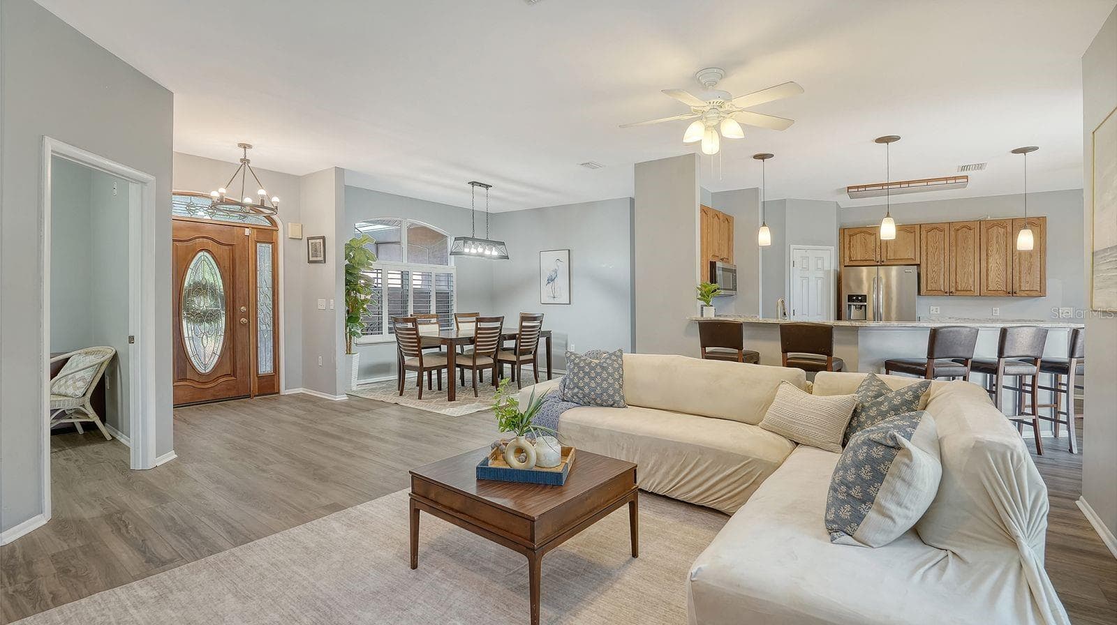 Open Floor Plan of Great Room, Formal Dining & Kitchen - 17618 WHITE TAIL CT, PARRISH