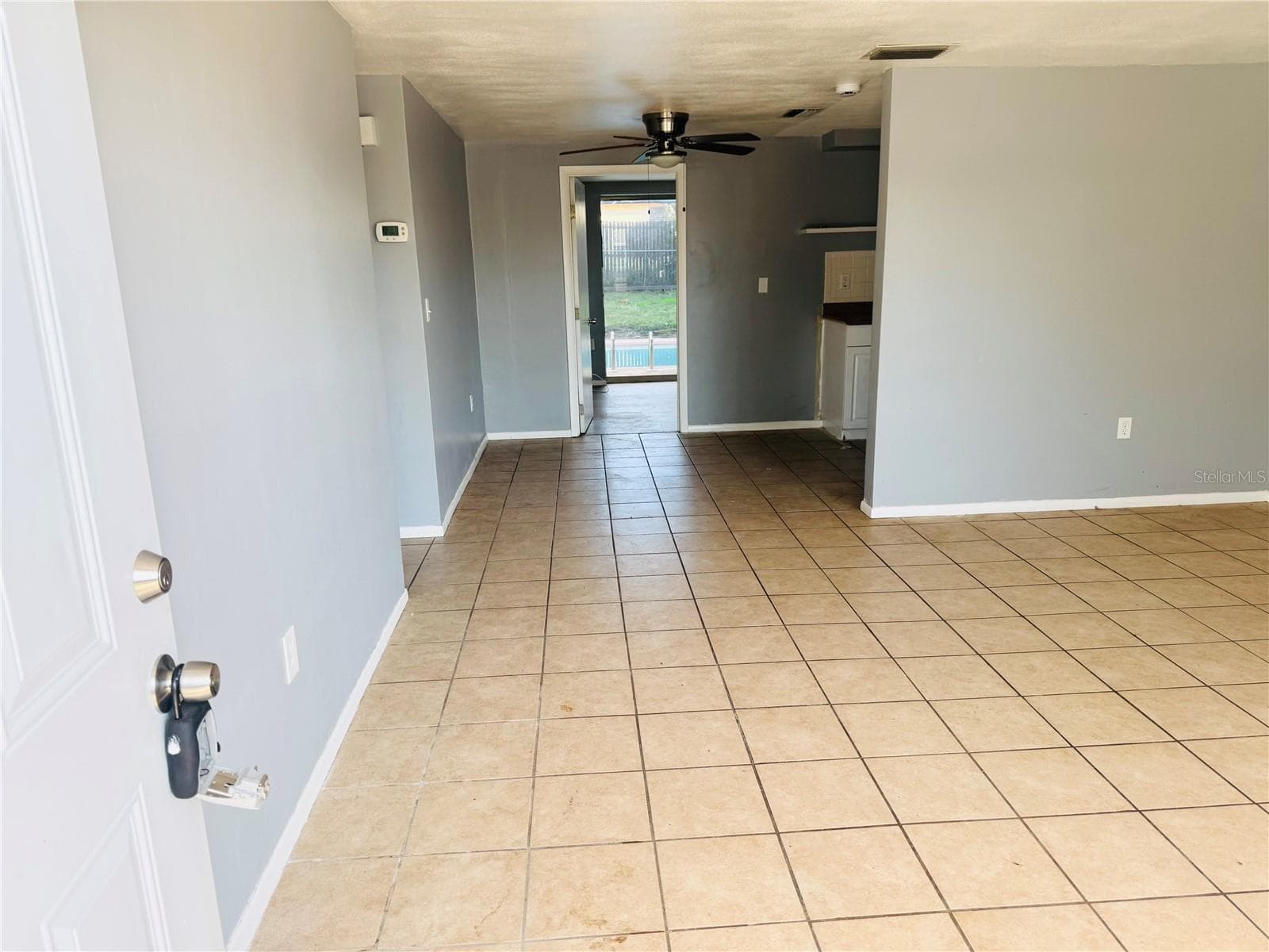 LIVING / DINING ROOM VIEW FROM FRONT DOOR - 7515 JUDITH CRES, PORT RICHEY