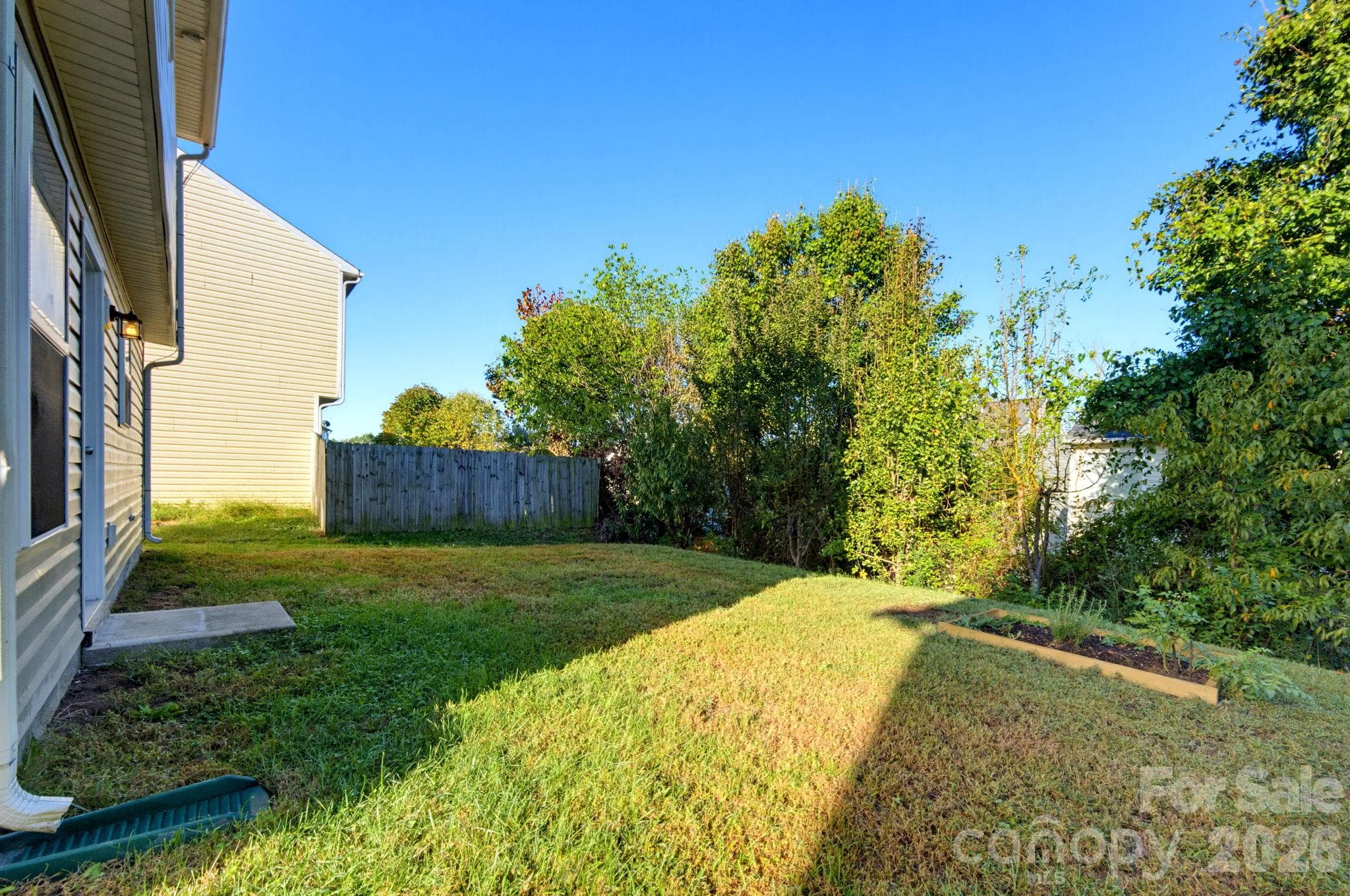 Backyard offering outdoor space to relax, play, or enjoy time outdoors. - 5718 Natick Drive, Charlotte