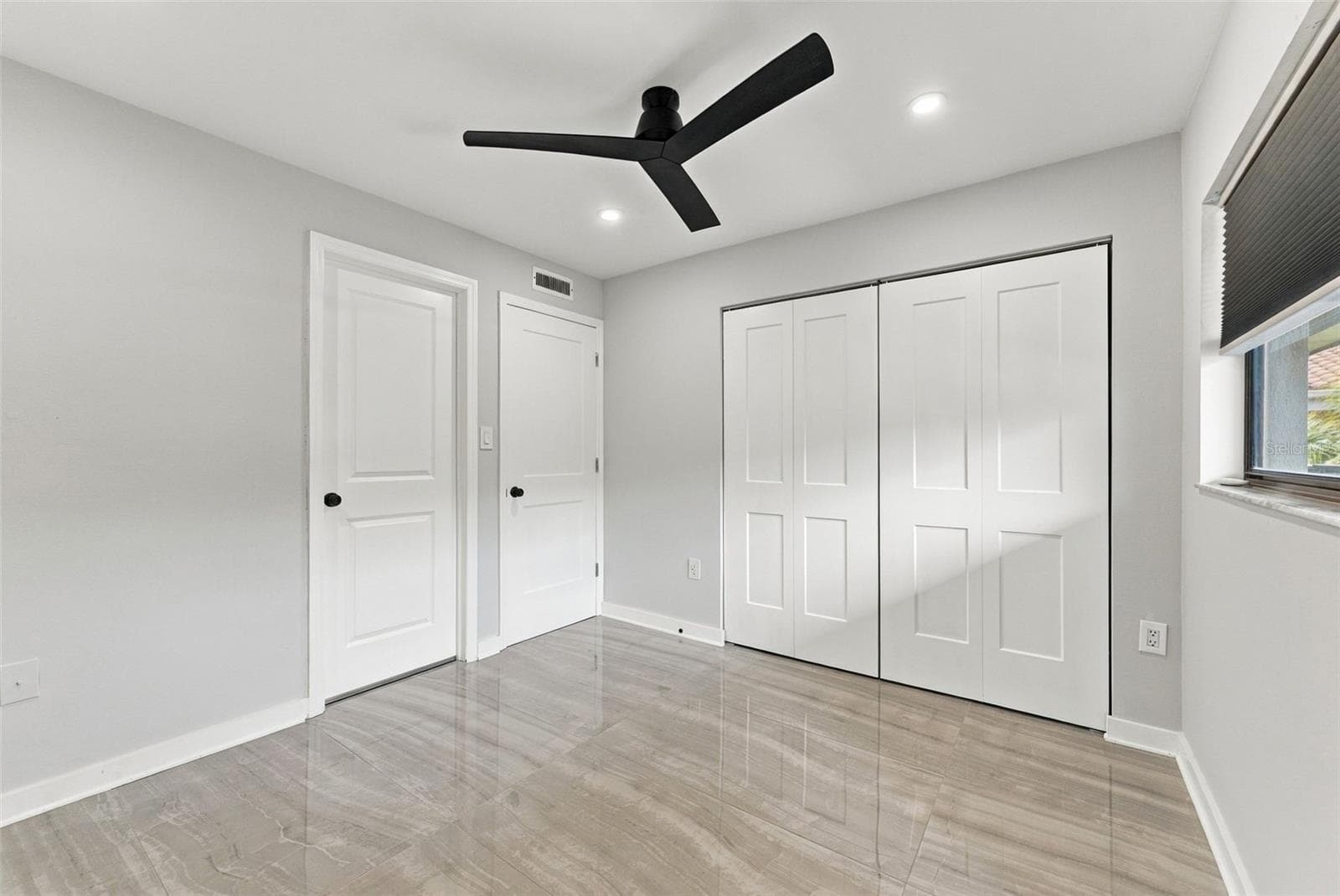 Generously sized bedroom two with a convenient built-in closet - 2650 COUNTRYSIDE BLVD #A306, CLEARWATER