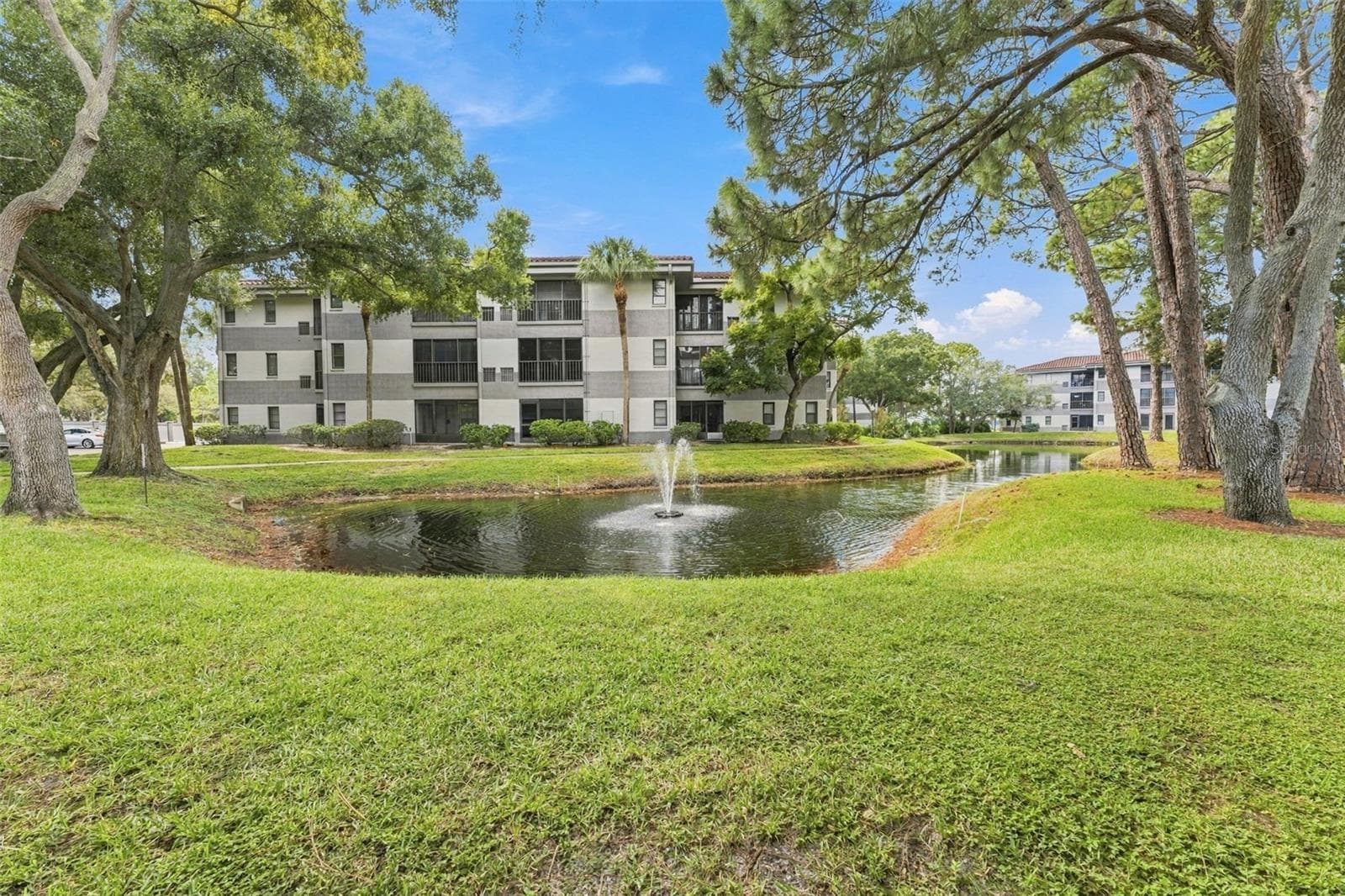 Peaceful community pond offering beautiful water views - 2650 COUNTRYSIDE BLVD #A306, CLEARWATER