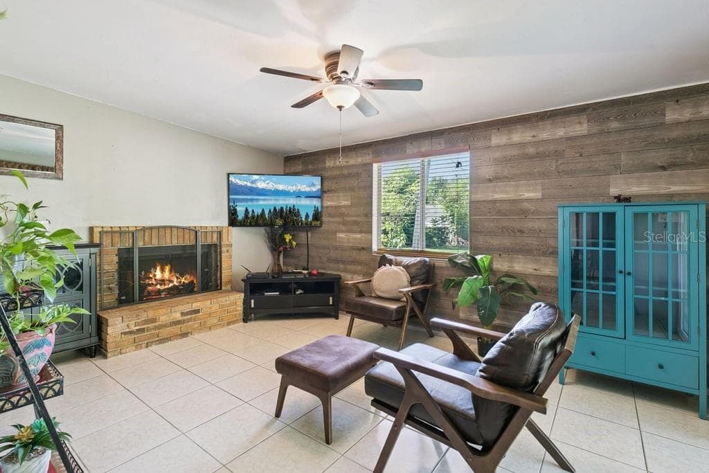 Another view of Family Room with Wood burning Fireplace - 8509 LYONIA DR, ORLANDO