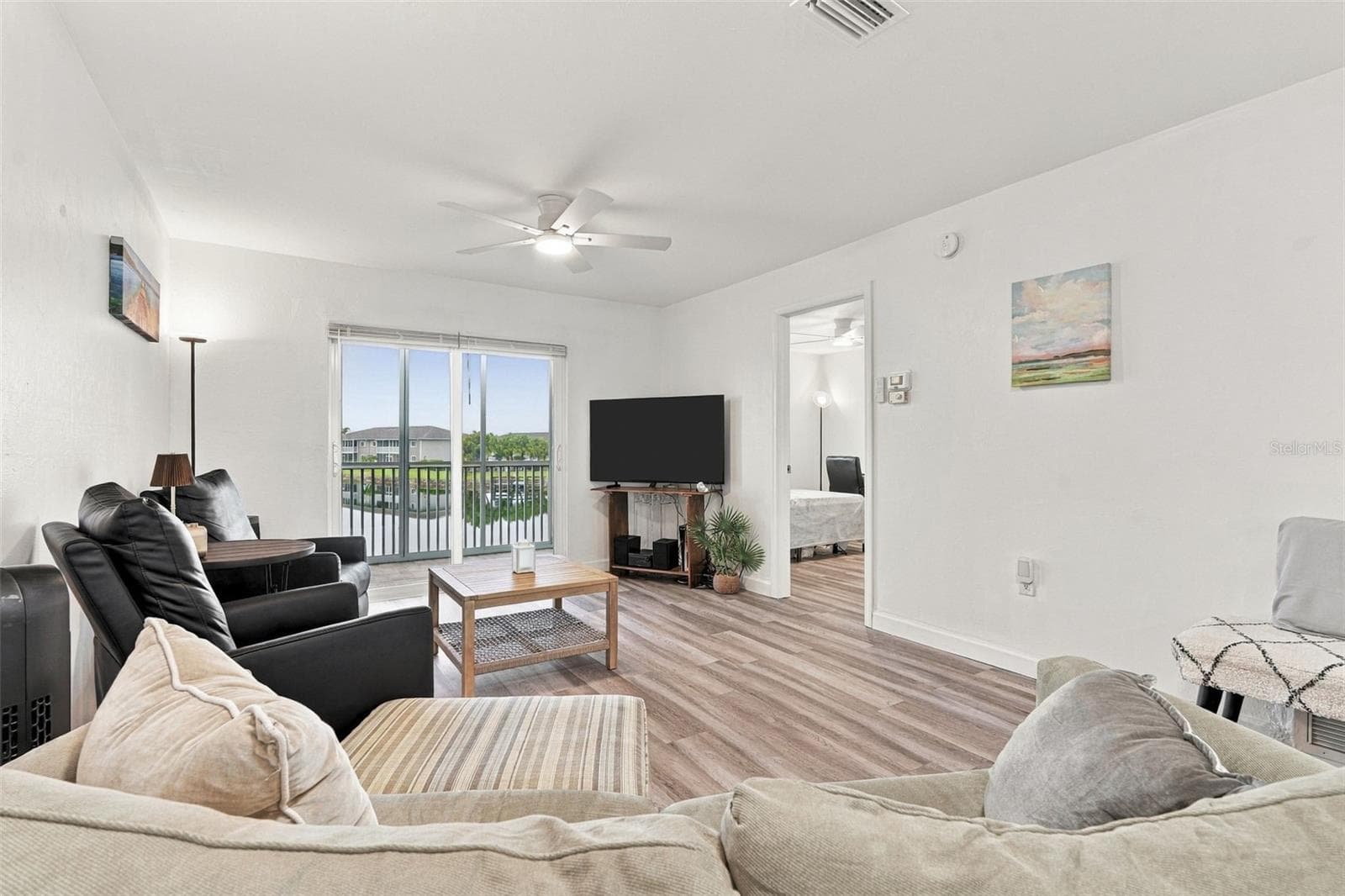 Inviting Living Area with Lanai Access - 12538 SW KINGSWAY CIR #1008, LAKE SUZY