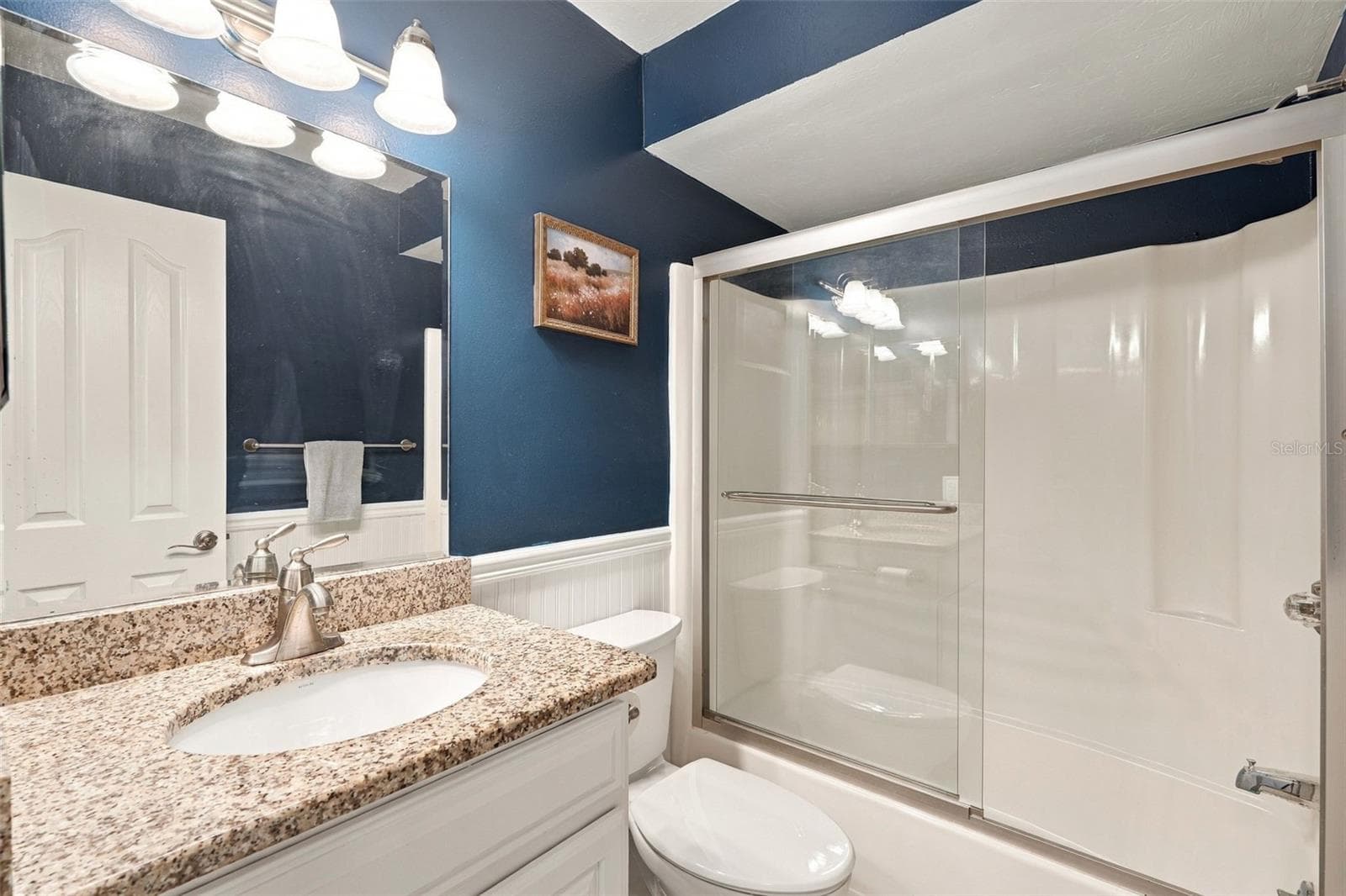 Guest Bathroom Features Granite Countertops and Tub/Shower Combo - 12538 SW KINGSWAY CIR #1008, LAKE SUZY