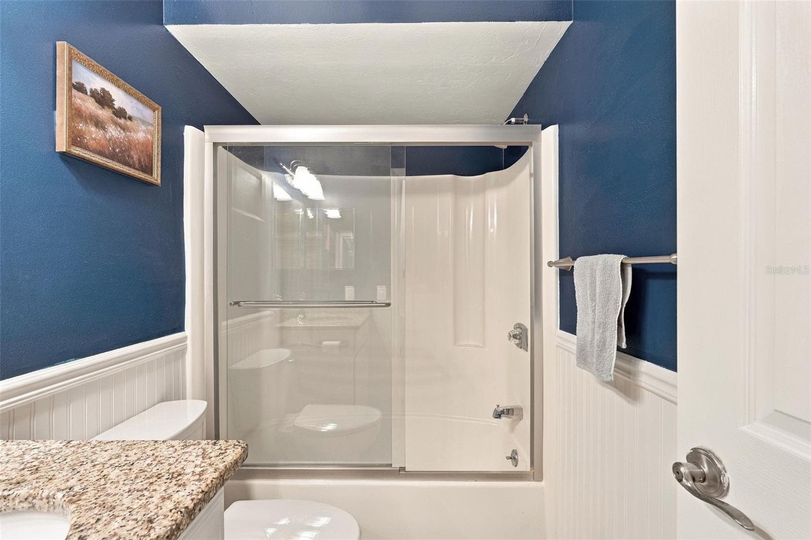 Guest Bathroom Features Granite Countertops and Tub/Shower Combo - 12538 SW KINGSWAY CIR #1008, LAKE SUZY