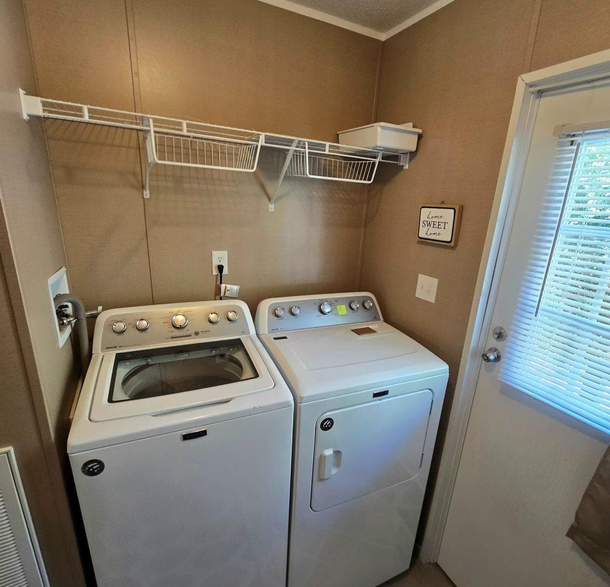 Laundry room washer and dryer - 9837 SE 160TH LN, SUMMERFIELD