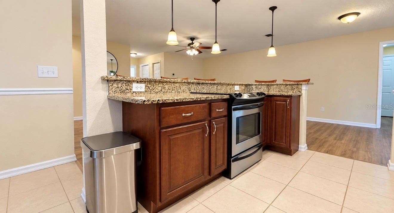 island in kitchen with granite counters - 1231 ROSEWOOD ST, LARGO