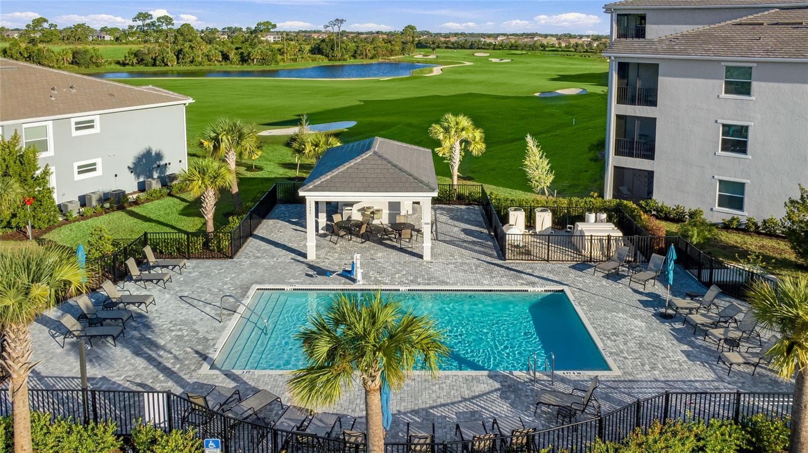 Building 100 right next to the Beautiful private Satellite Pool with stunning Golf Course, water and Preserve View - 17565 OPAL SAND DR #204, VENICE