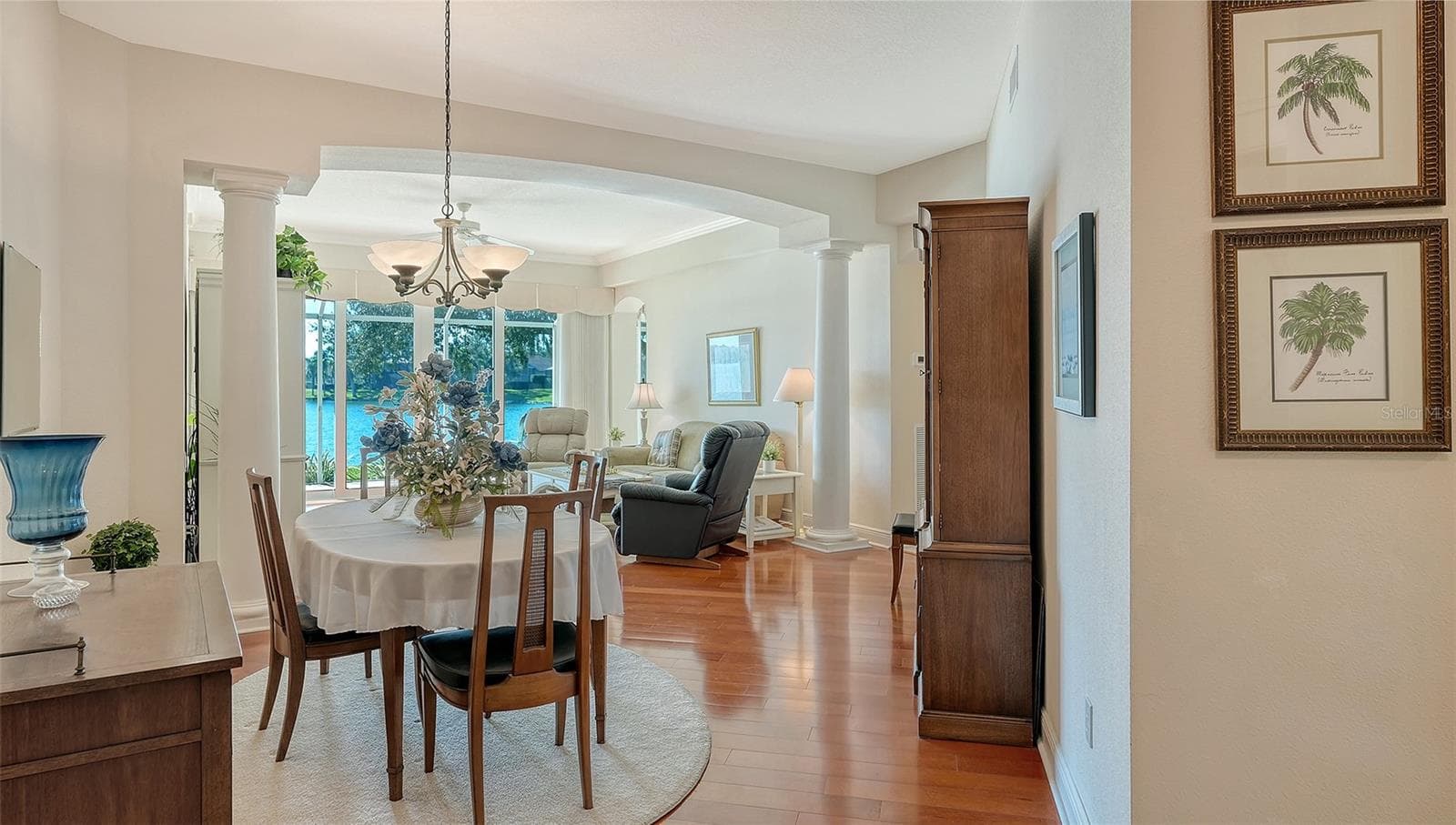 Elegant dining area with stunning wood flooring - 6531 MOORINGS POINT CIR #102, LAKEWOOD RANCH