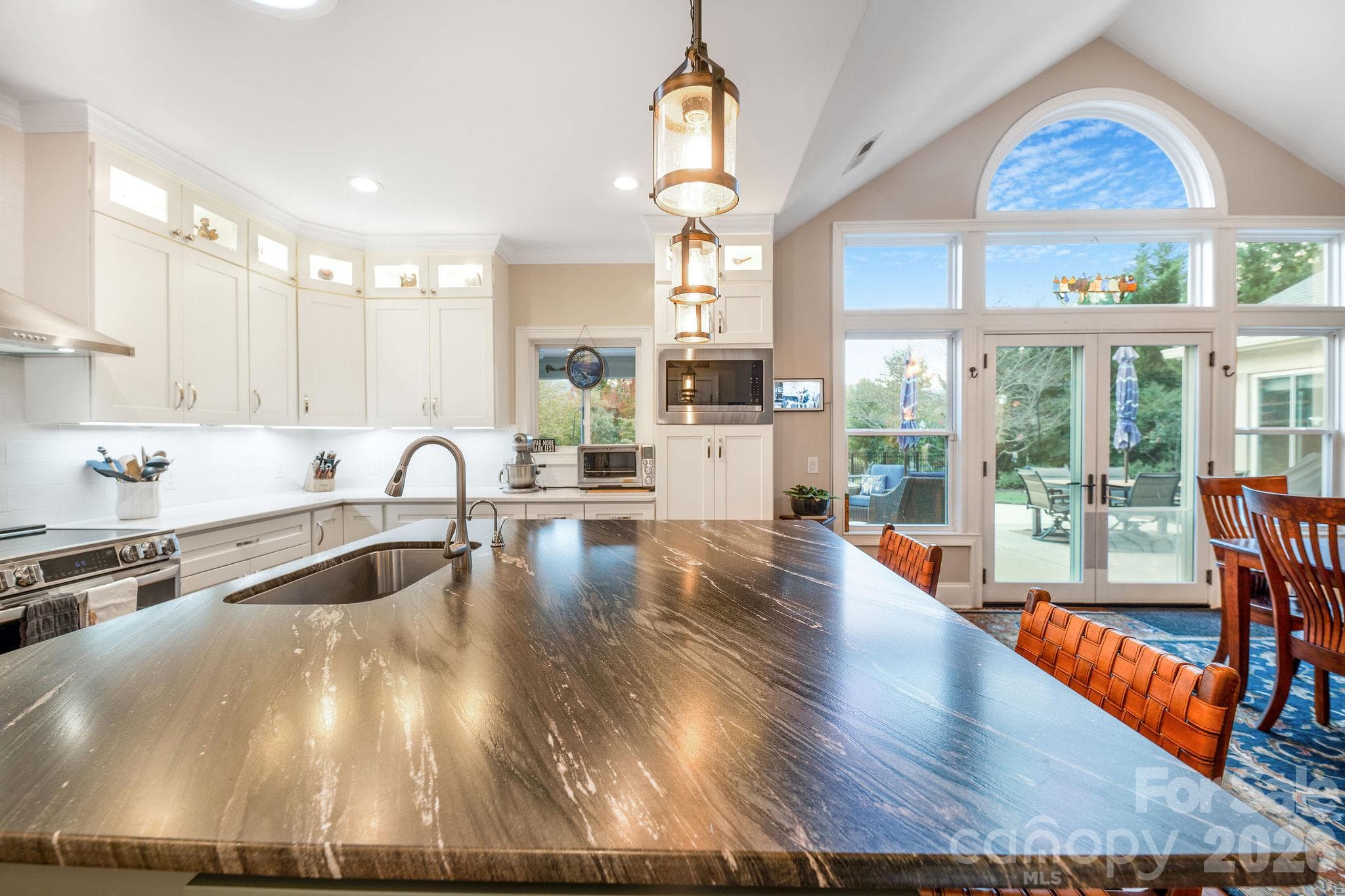Expansive kitchen island ideal for entertaining, meal preparation, and casual dining - 28 Penley Park Drive, Weaverville